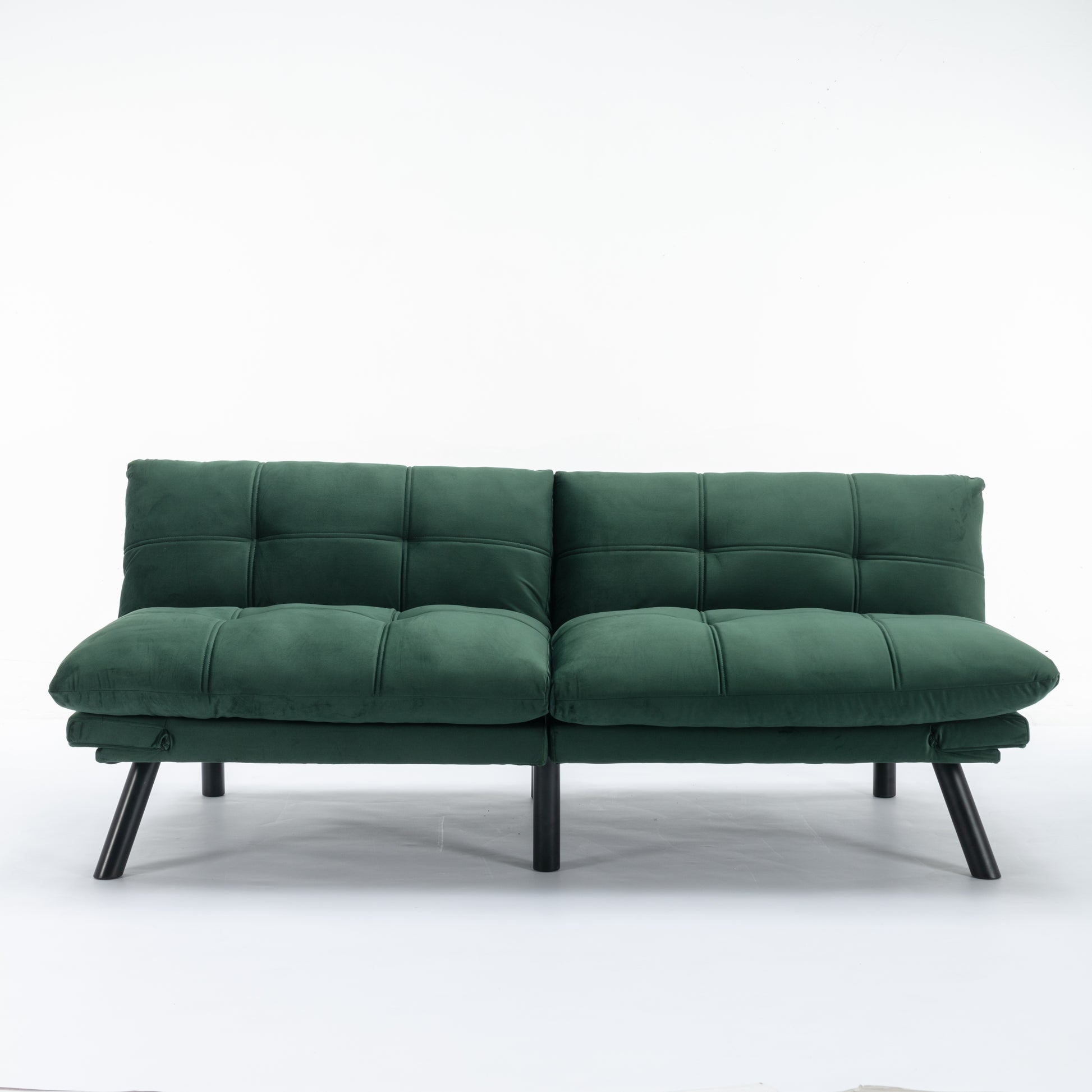 Deep green velvet futon sofa with tufted cushions and black legs