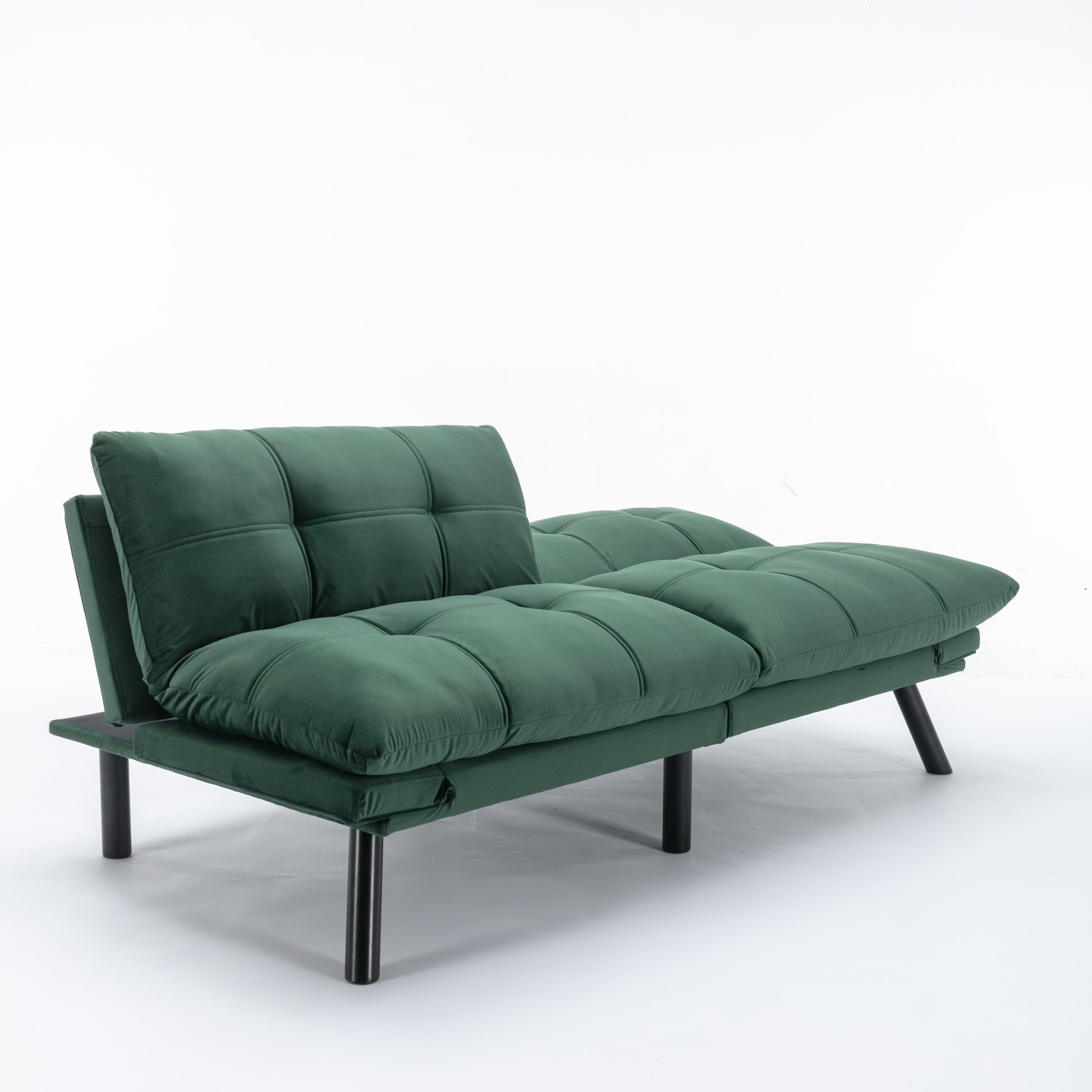 Green velvet sofa bed with tufted cushions and black metal legs perfect for small spaces
