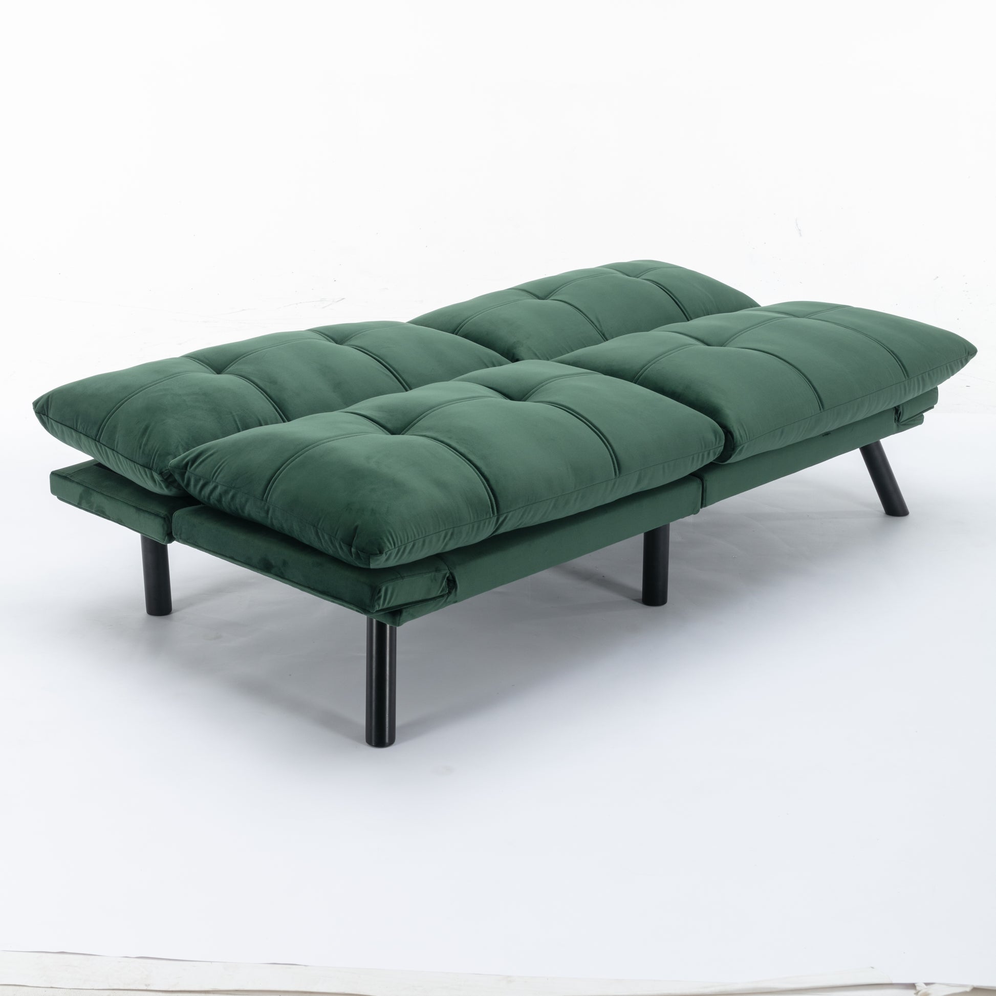 Tufted dark green velvet futon with black metal legs a stylish and comfortable sofa bed