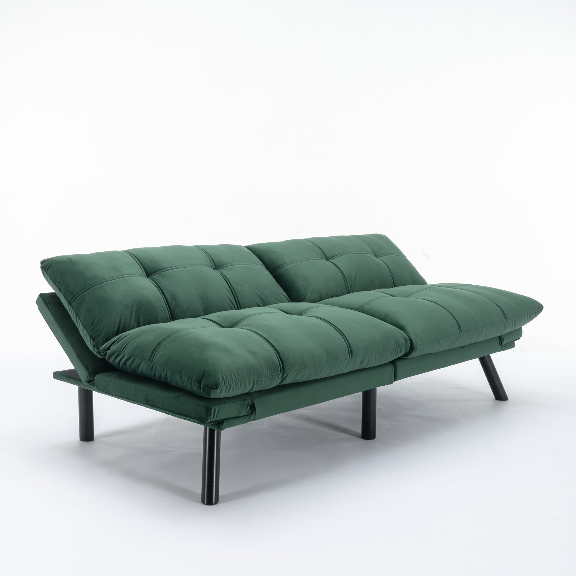 Deep green velvet futon sofa with tufted cushions and black legs