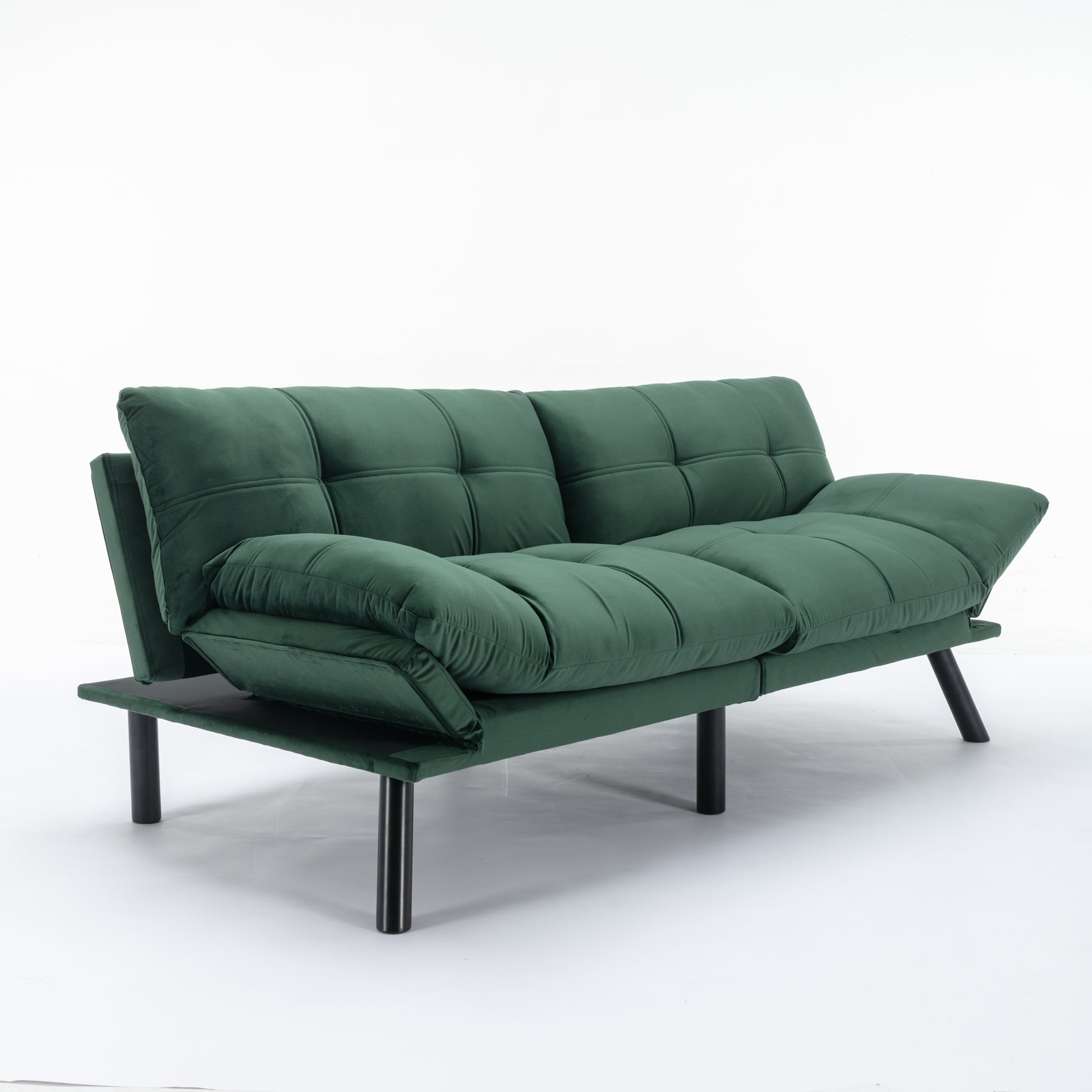 Deep green velvet futon sofa with tufted cushions and black legs