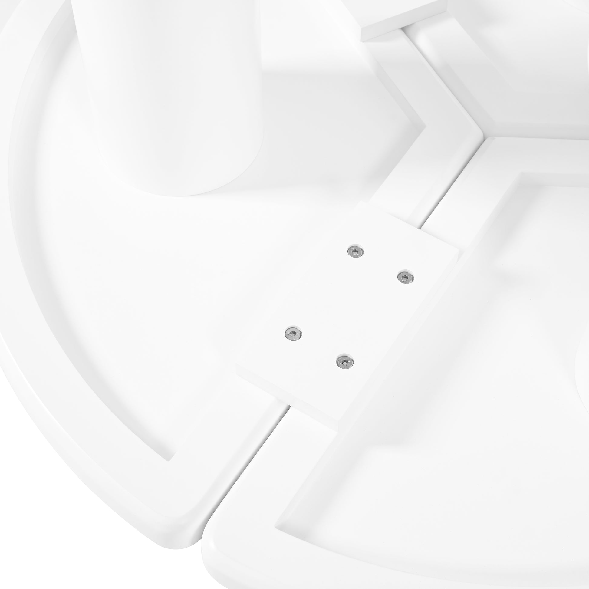 Closeup of white plastic desk with hexagonal bolt heads and integrated leg support