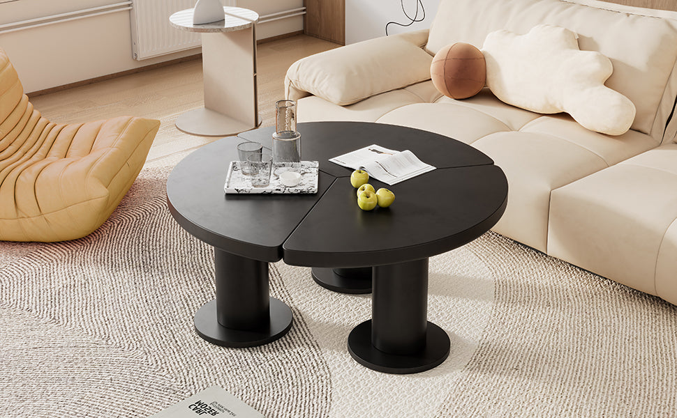 Modern black sectional coffee table with three petalshaped segments and cylindrical bases