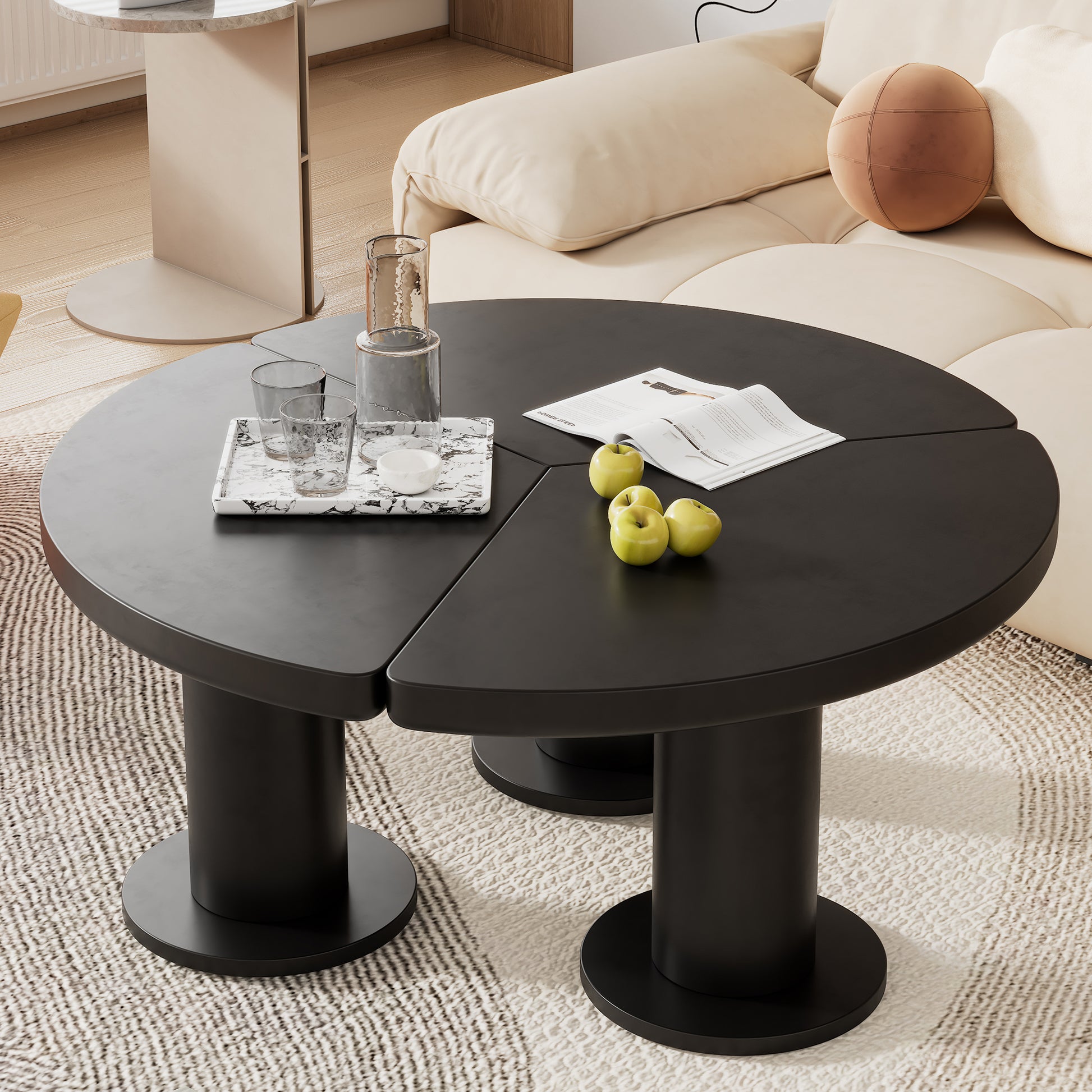 Matte black round coffee table with cylindrical pedestals perfect for modern living rooms
