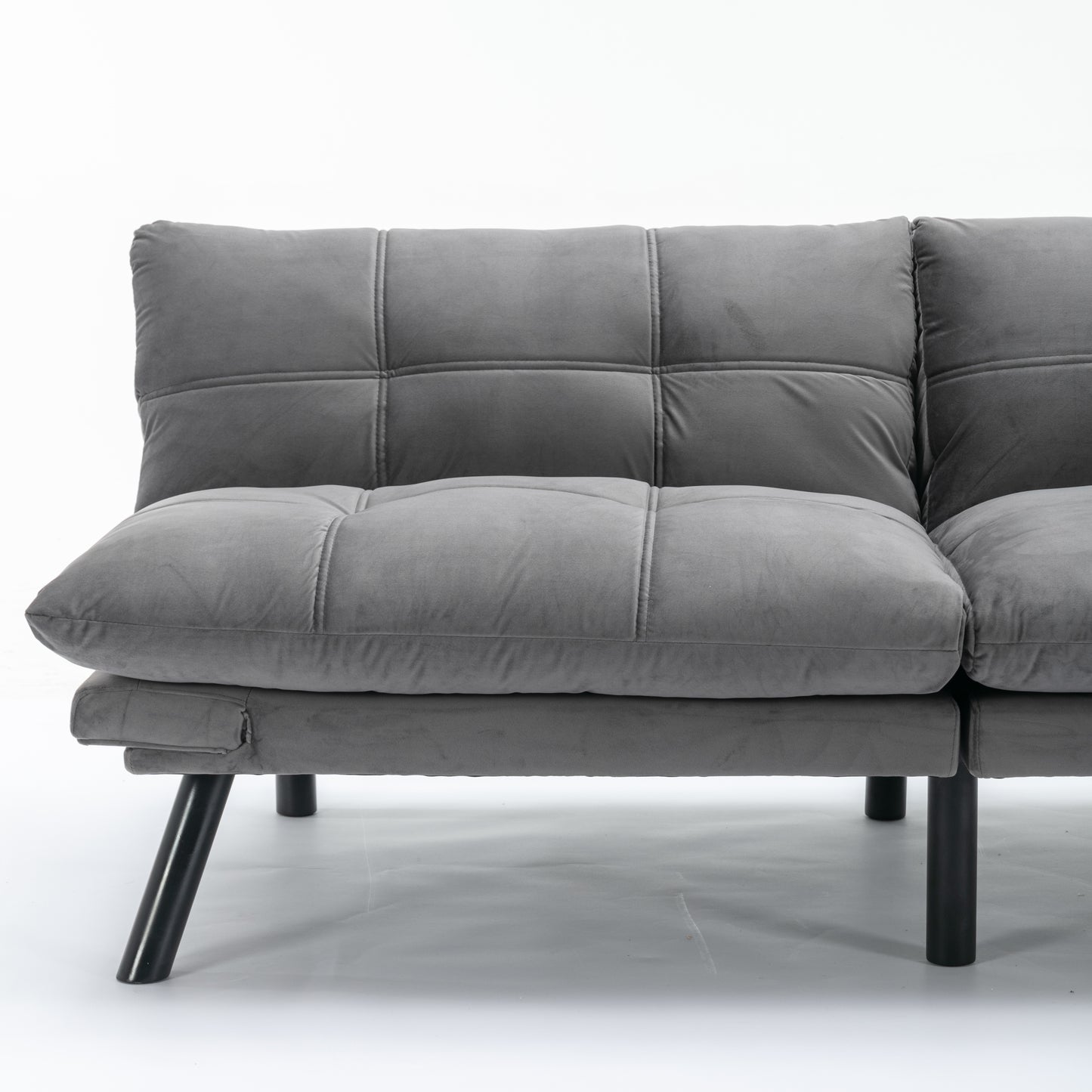 Tufted grey velvet sofa with modern black legs perfect for small spaces