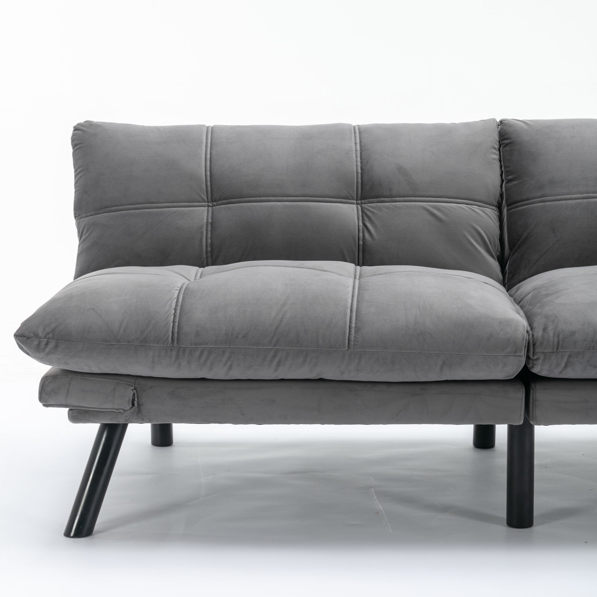Tufted grey velvet sofa with modern black legs perfect for small spaces