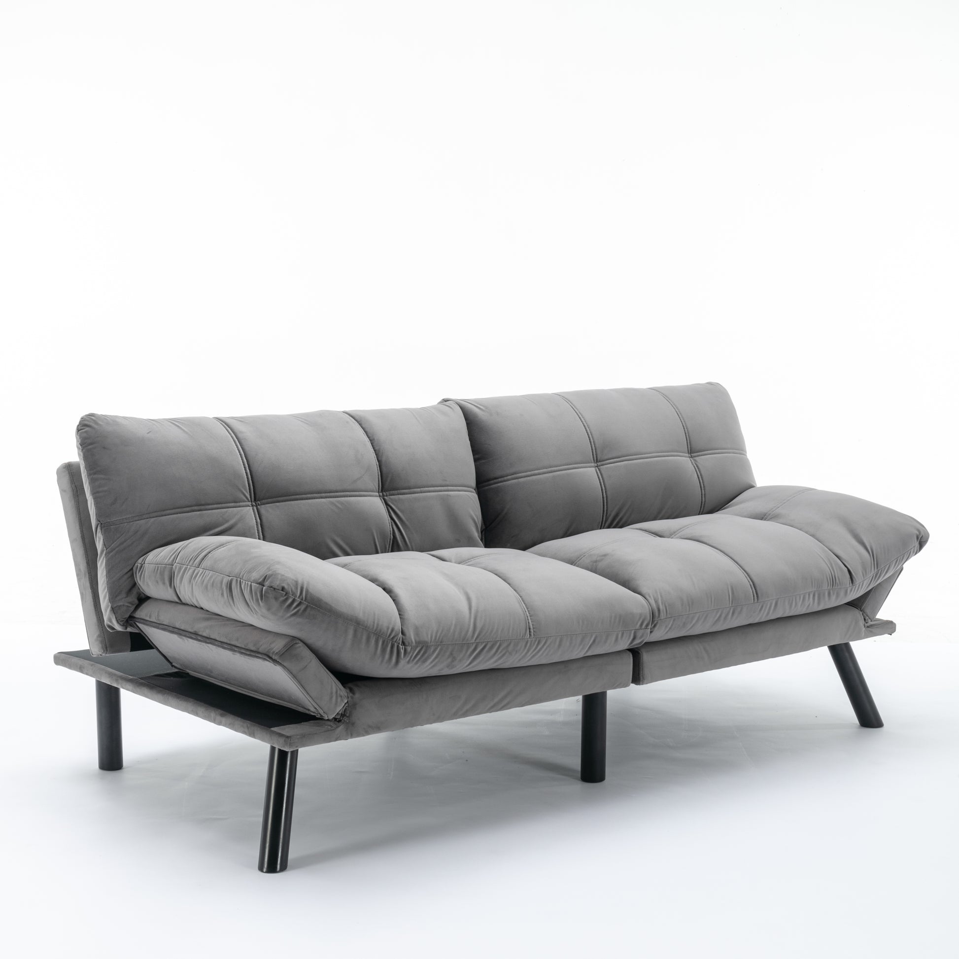 Grey fabric futon sofa with tufted cushions and modern black legs