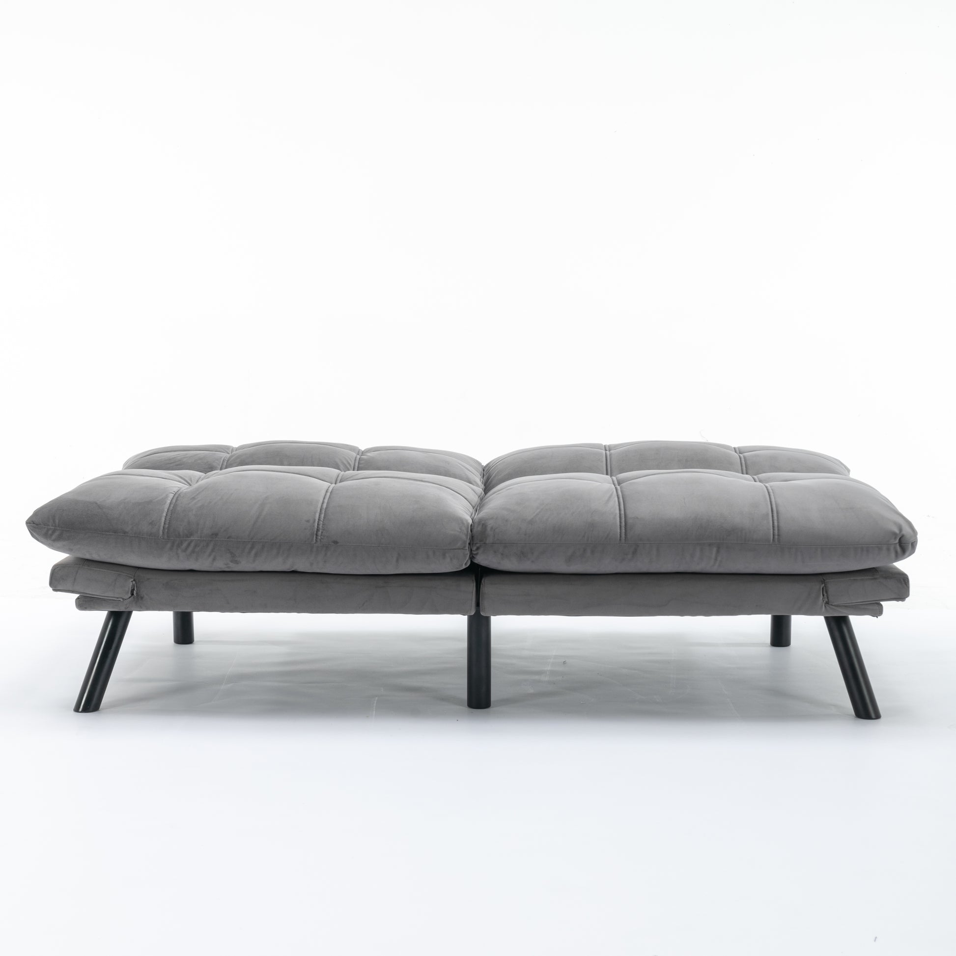 Tufted gray velvet futon with modern black legs perfect for small spaces
