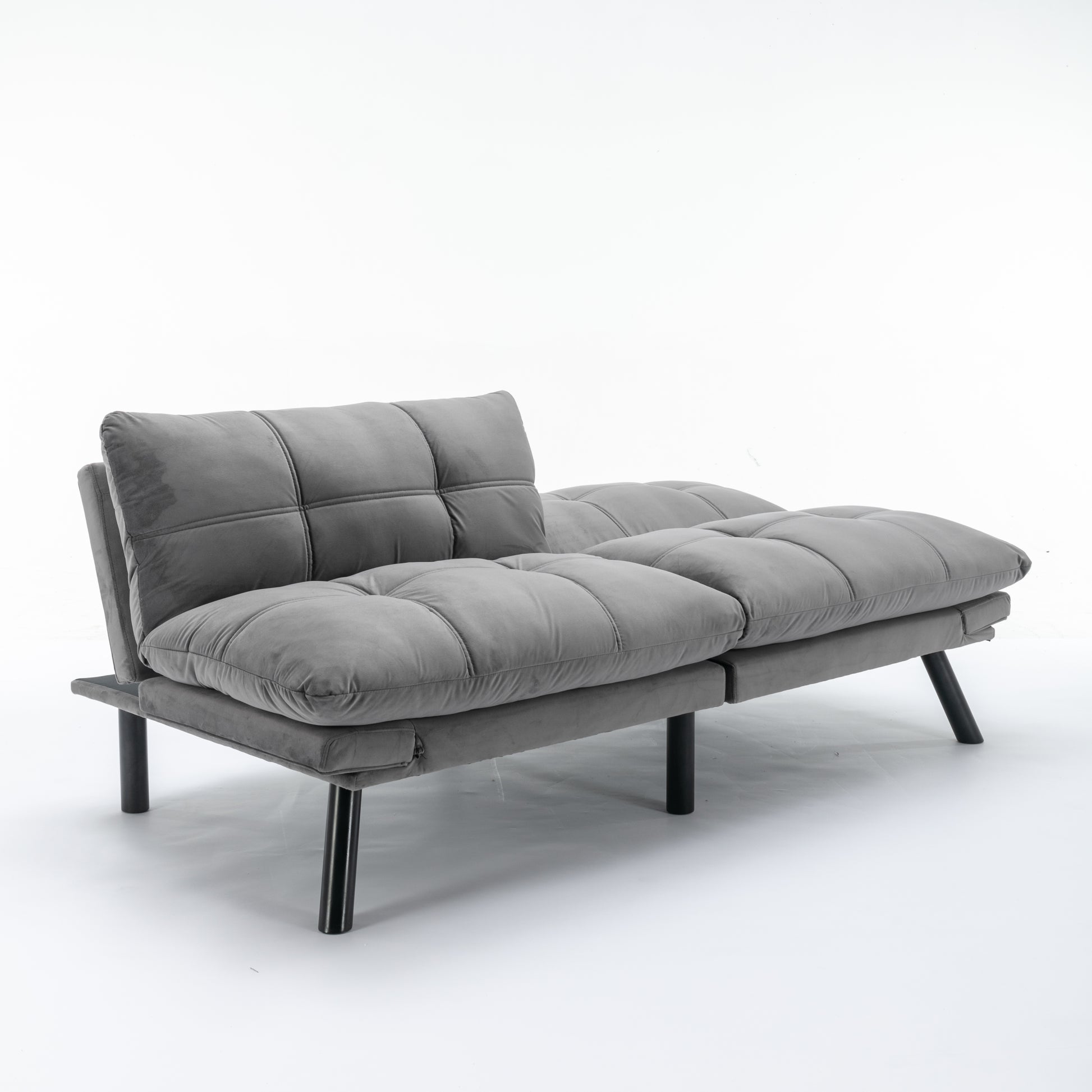 Grey velvet convertible sofa with tufted cushions and black metal legs perfect for small spaces