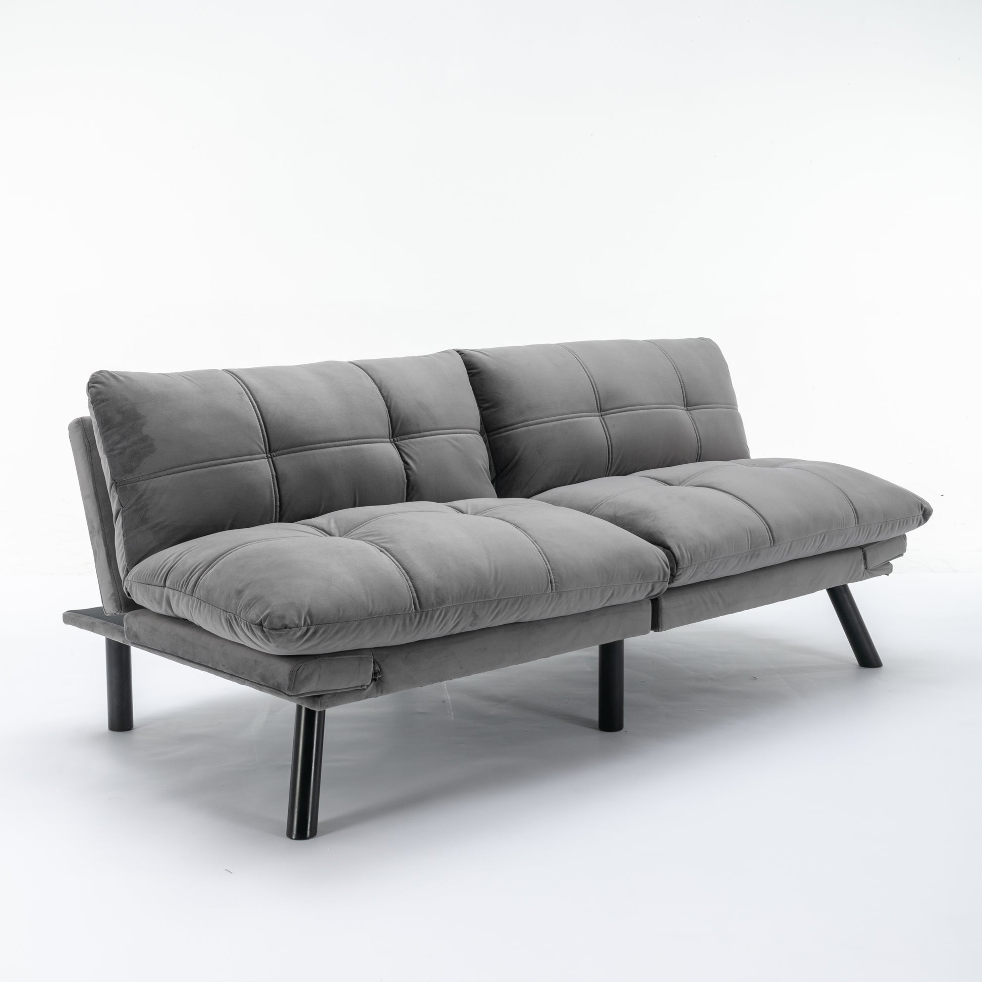 Tufted gray velvet futon sofa with sleek black legs ideal for small spaces