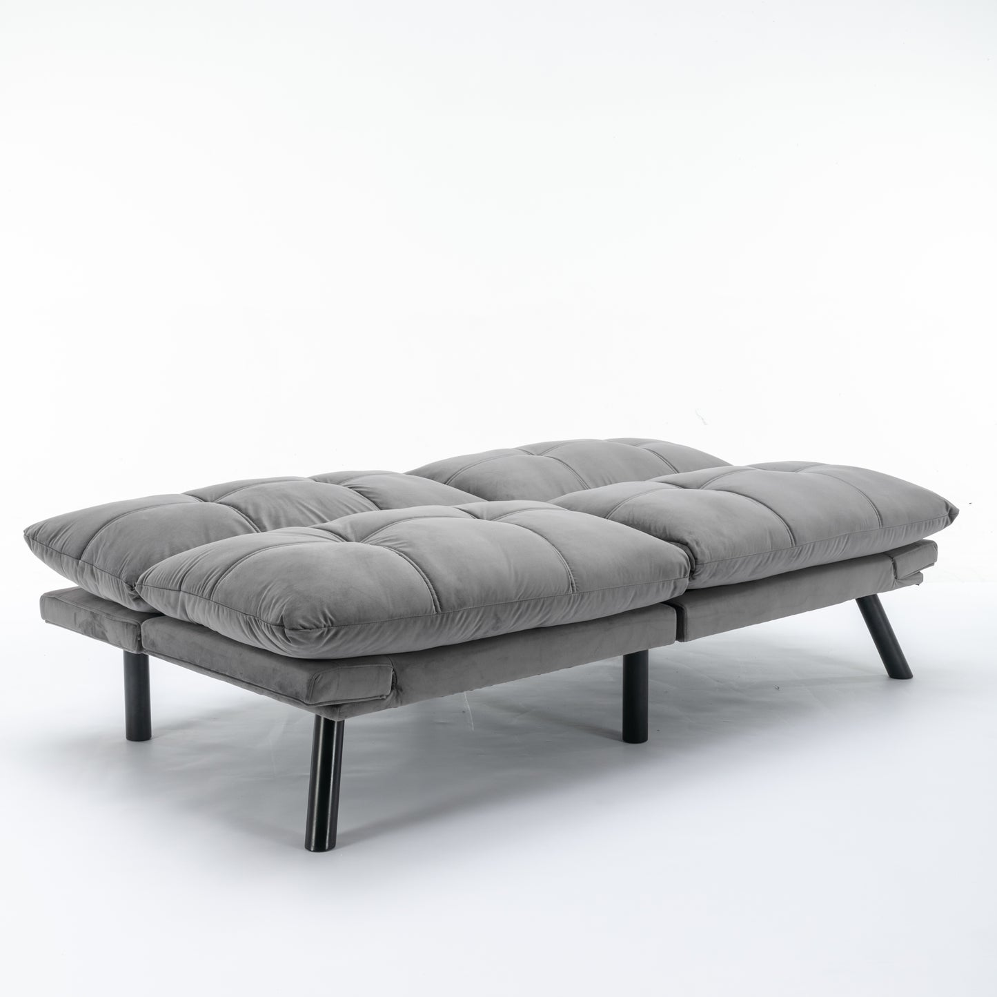 Modern gray velvet futon with tufted cushions and black metal legs