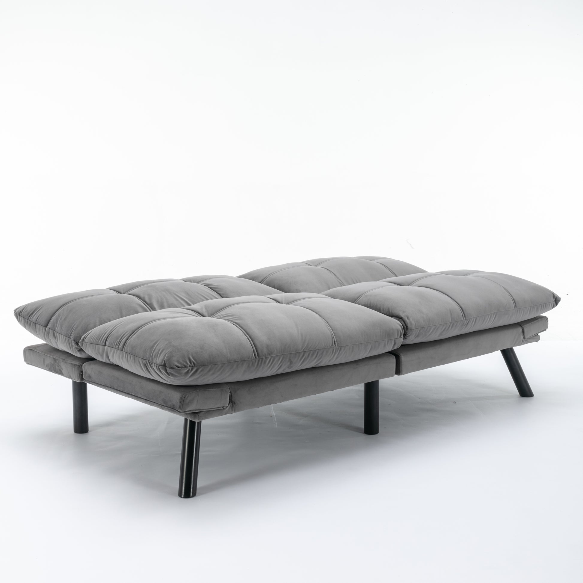 Modern gray velvet futon with tufted cushions and black metal legs