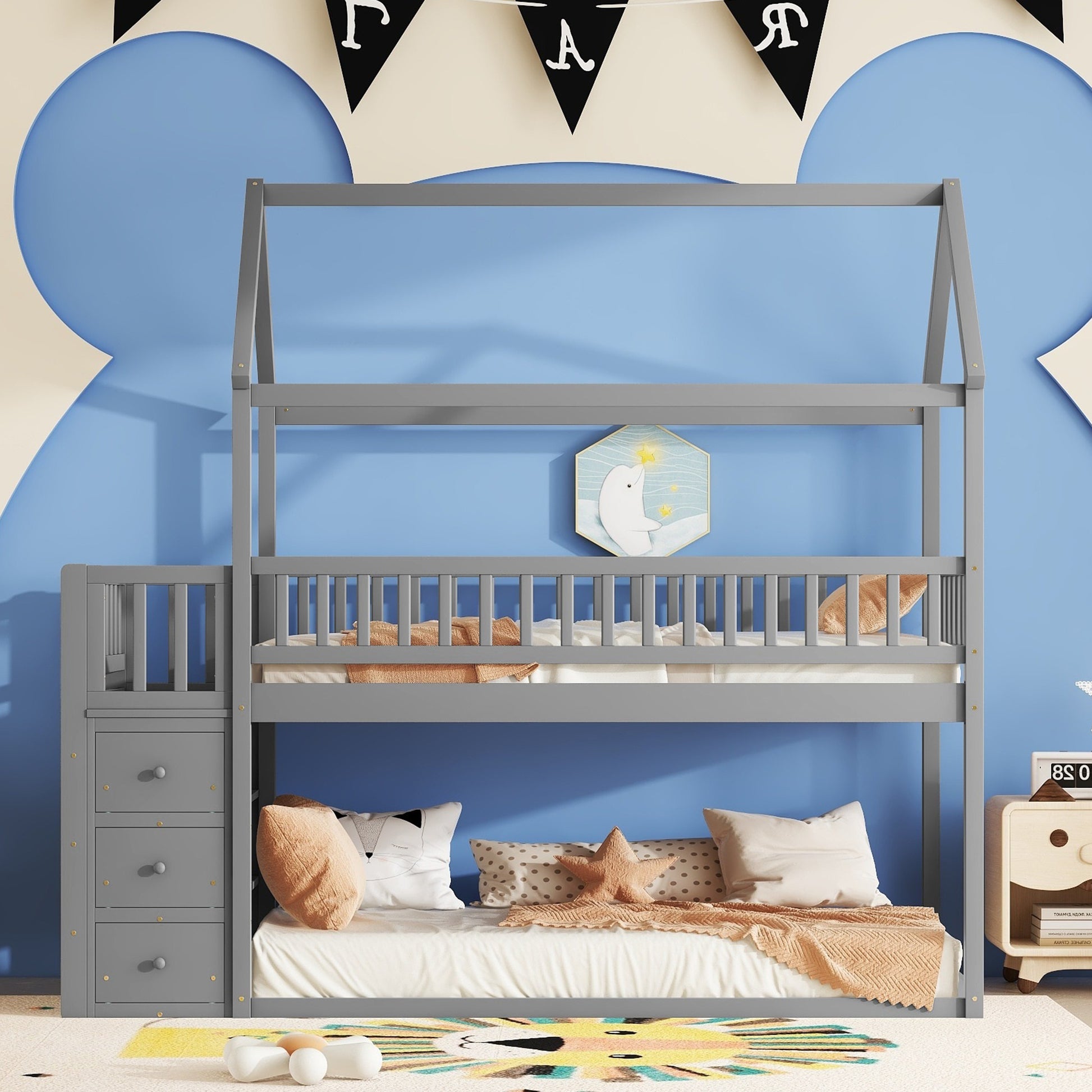 Gray wooden twin over twin bunk bed with drawers and a house frame