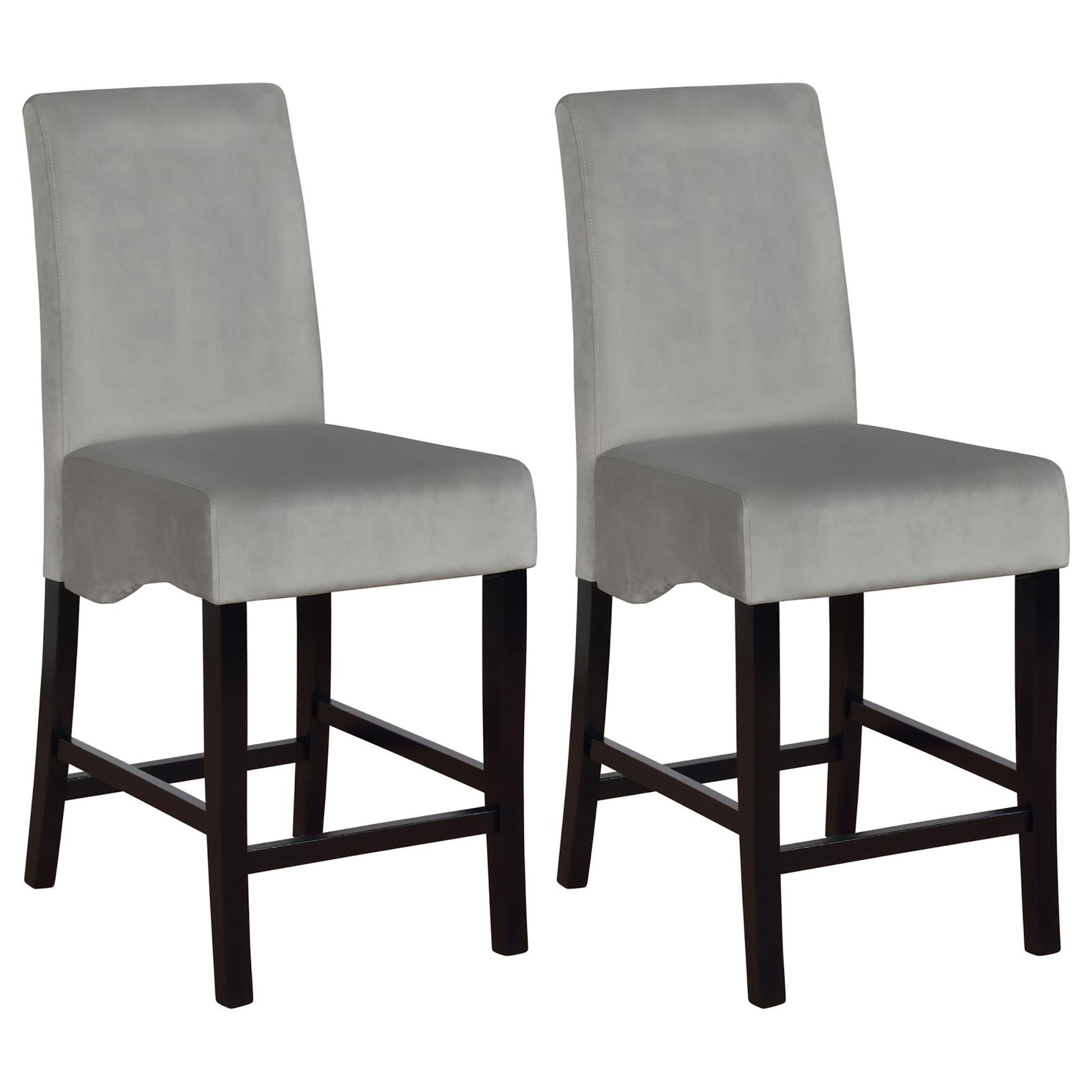 Two plush grey velvet upholstered bar stools with dark wooden legs
