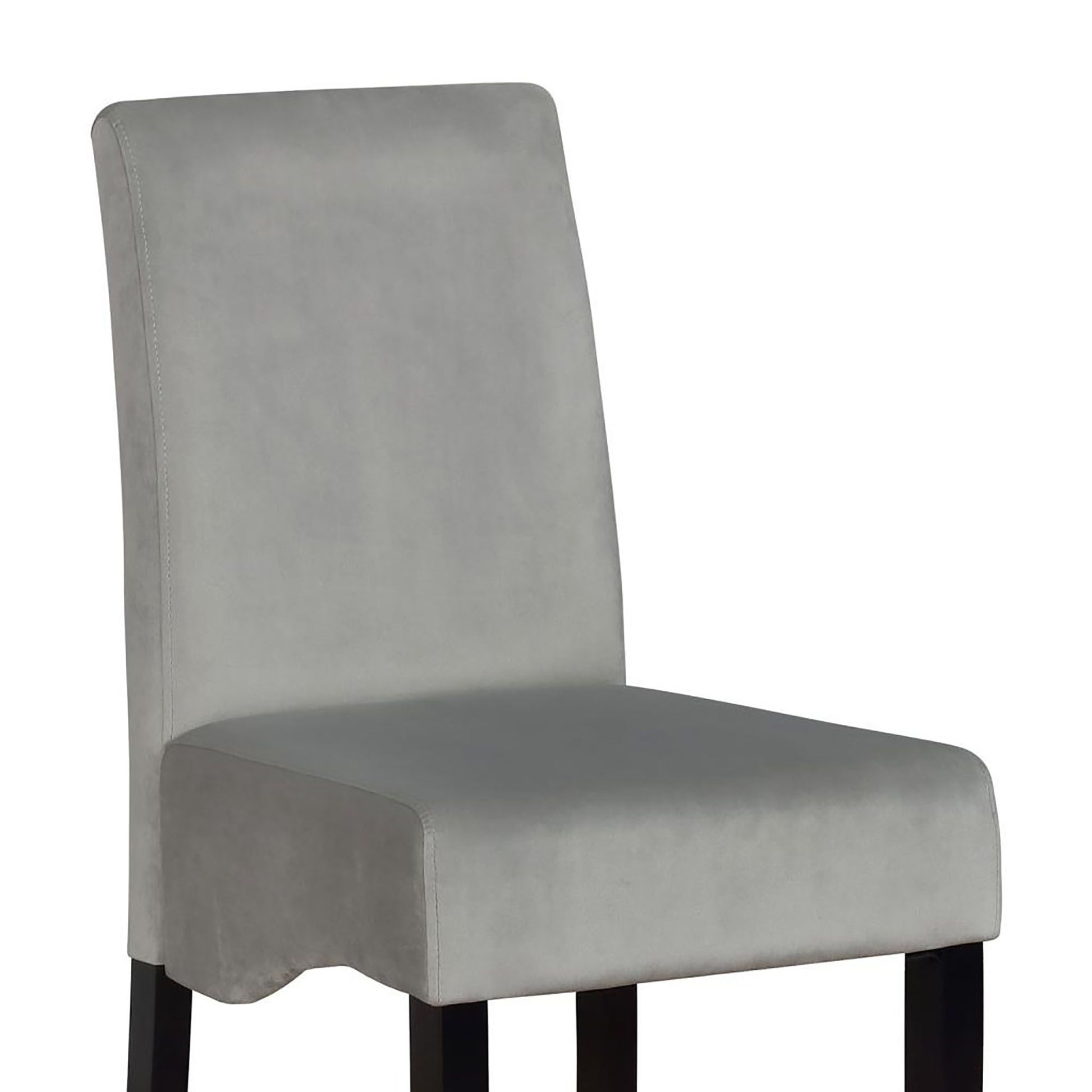 Close up of a plush grey upholstered dining chair with a tall backrest