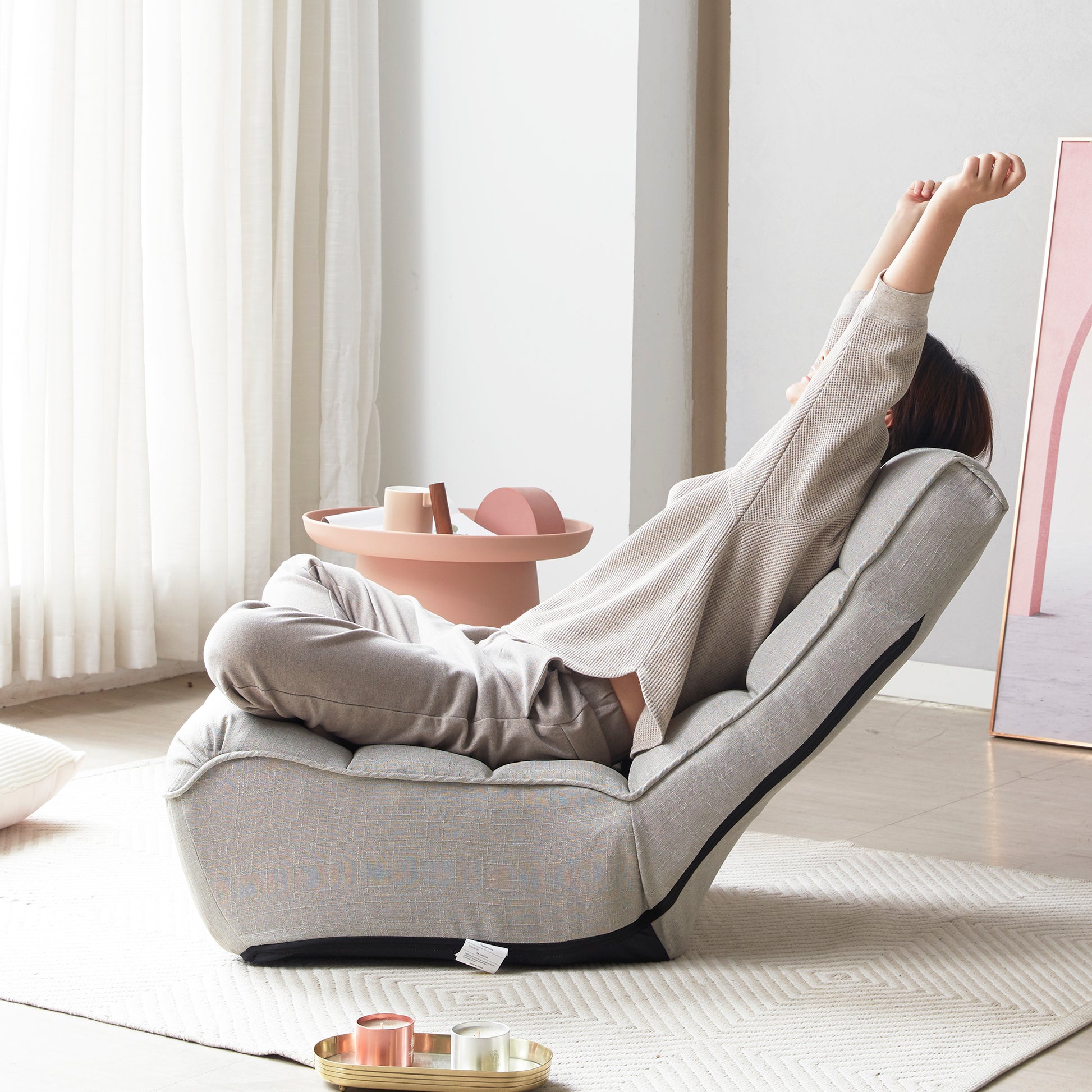 Comfortable grey adjustable floor chair perfect for reading or relaxing
