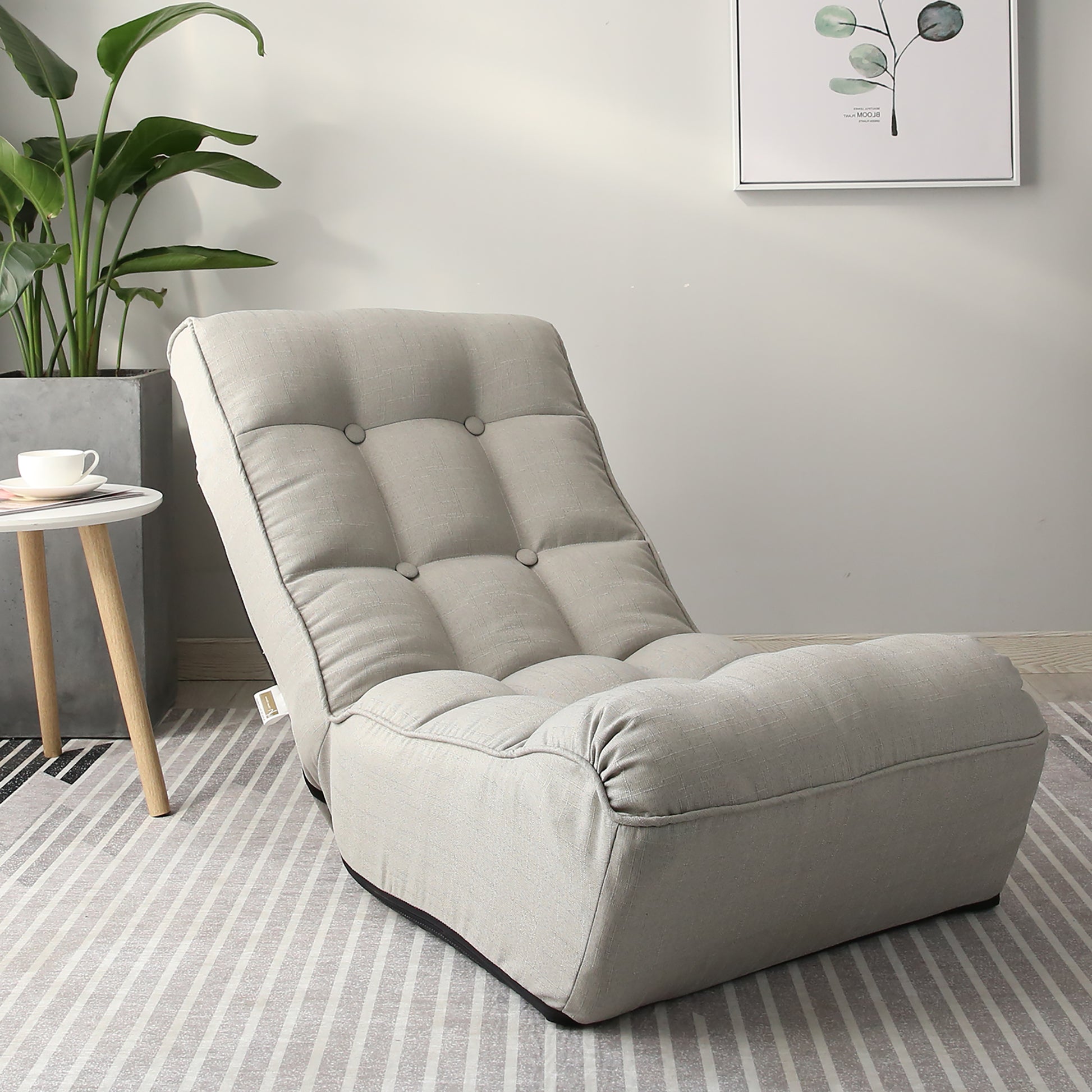 Light gray linen floor chair with adjustable backrest and tufted cushions for comfortable seating