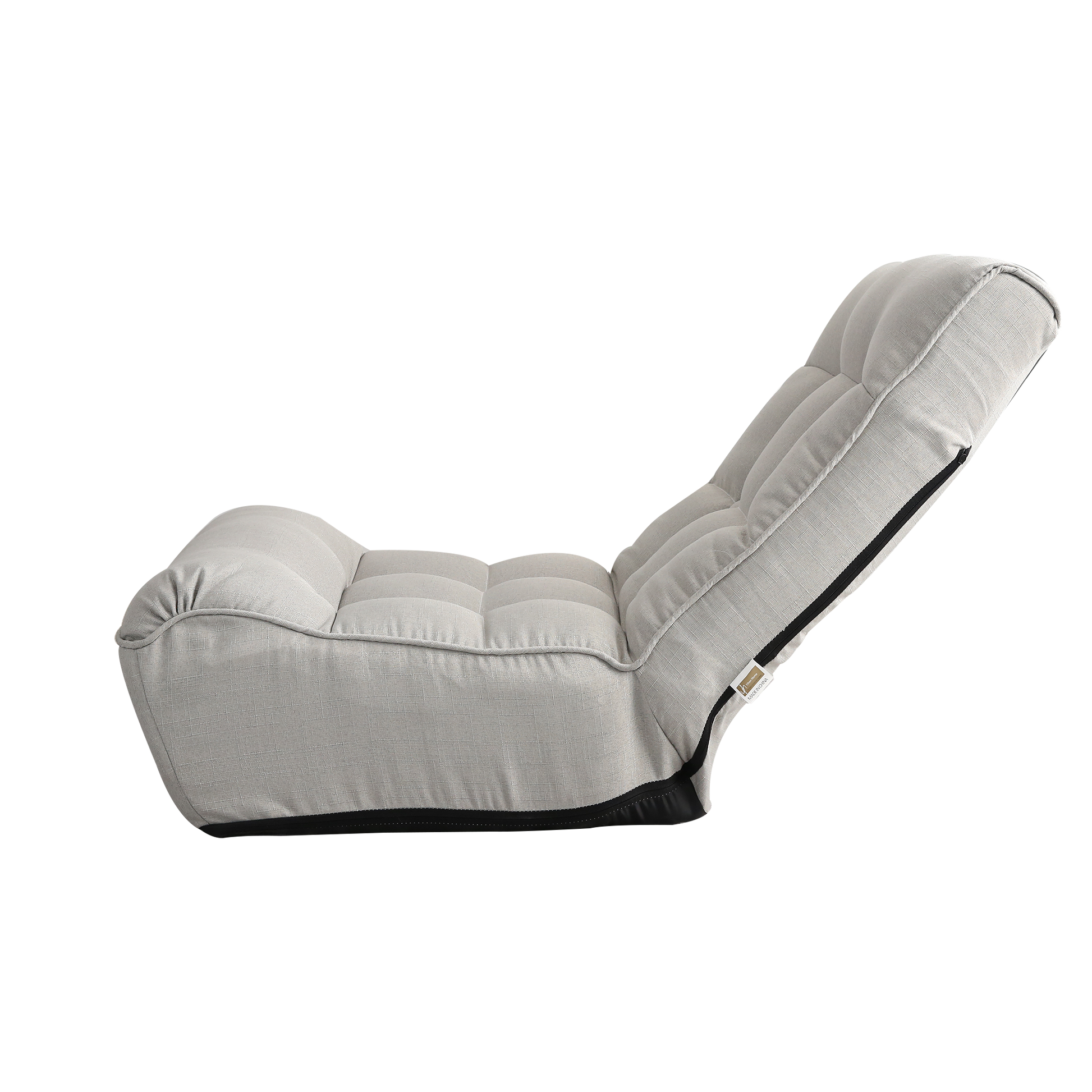 Light gray linen floor chair with tufted cushioning and adjustable back support