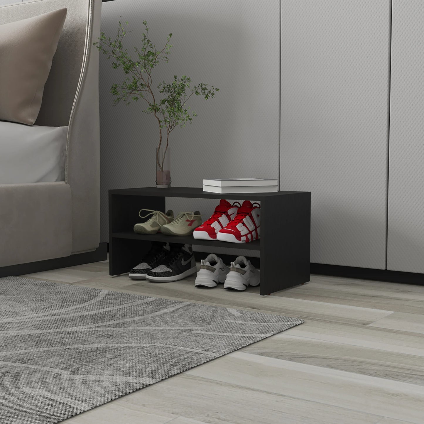 Black tier shoe rack with tan and red athletic shoes