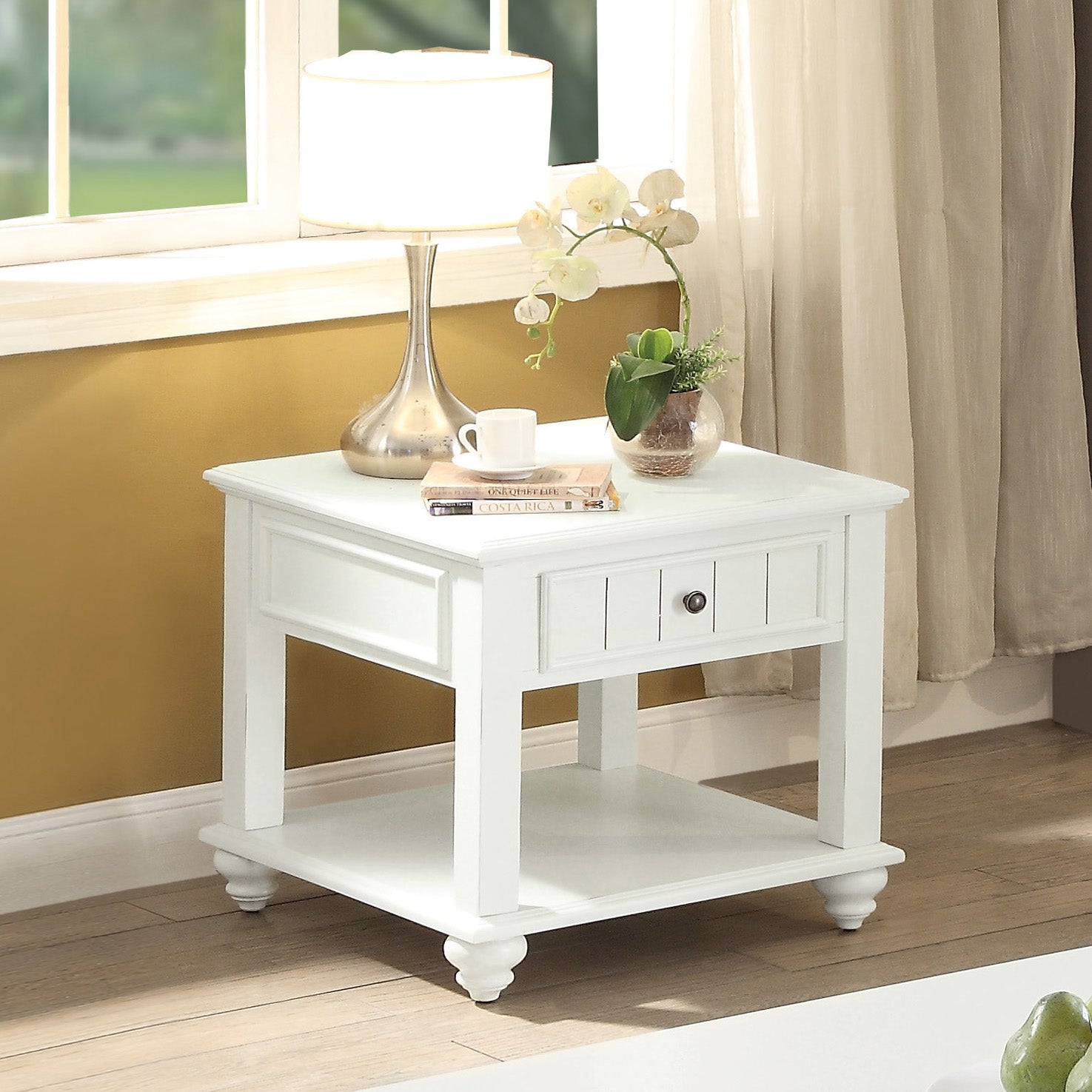 White farmhouse end table with turned legs and a single drawer