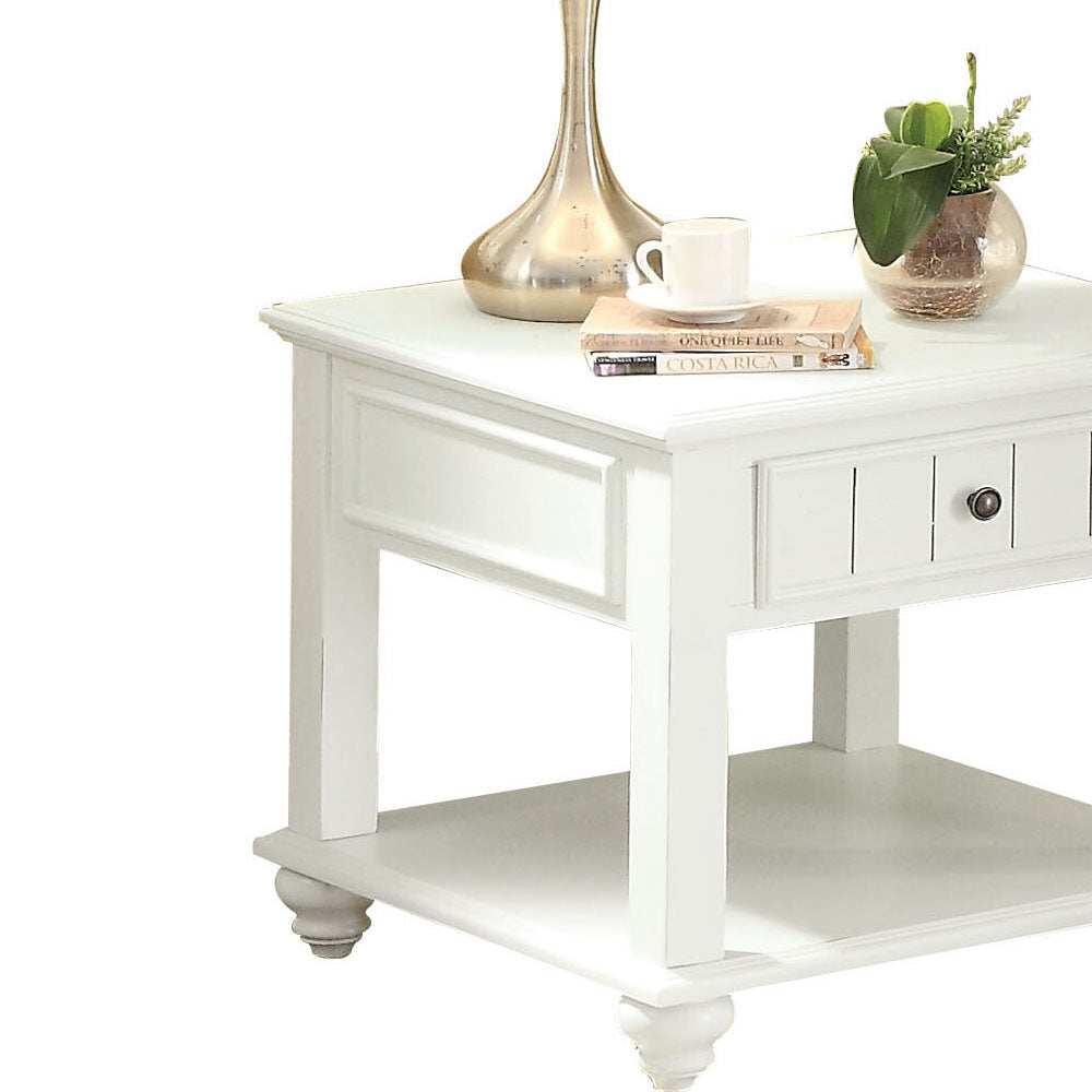 White farmhouse end table with drawer open shelf and decorative molding