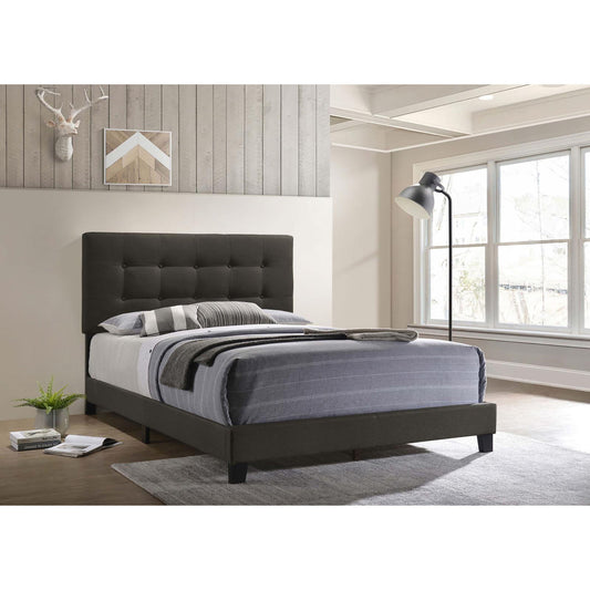 Dark gray upholstered queen bed frame with tufted headboard and striped bedding
