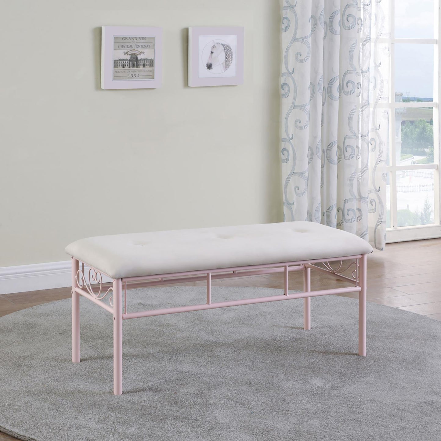 Tufted white upholstered bench with pink metal scrollwork frame perfect for entryway accent