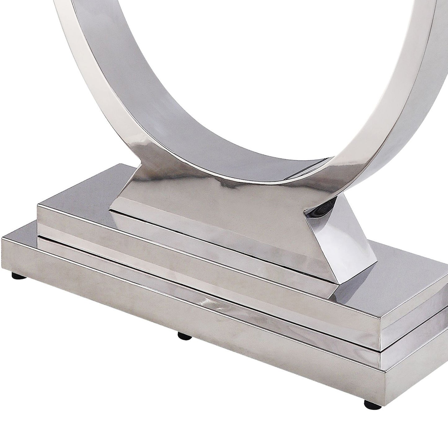 Close up of a polished chrome console table base with geometric lines and stacked rectangular design
