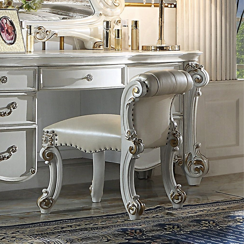 Victorian vanity stool with white padded seat and ornate carved legs