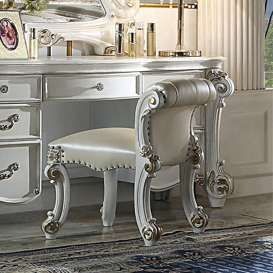 Victorian vanity stool with white padded seat and ornate carved legs