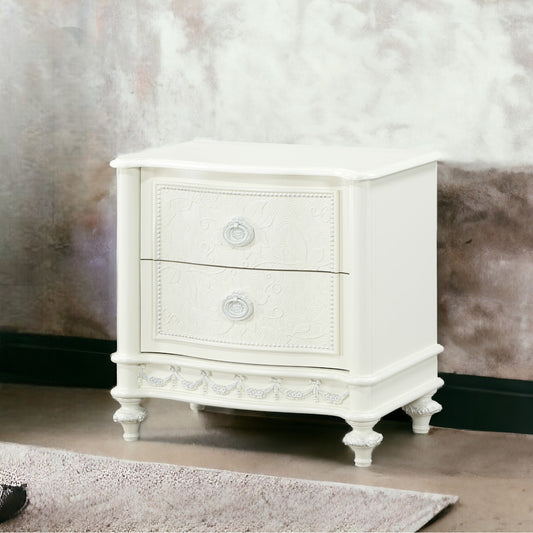 Elegant white twodrawer nightstand with decorative carving a classic bedroom accent