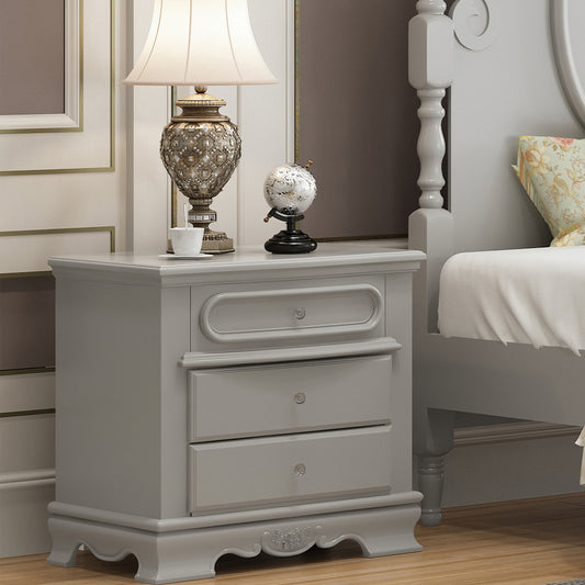 Elegant grey threedrawer nightstand with decorative knobs perfect for bedroom storage