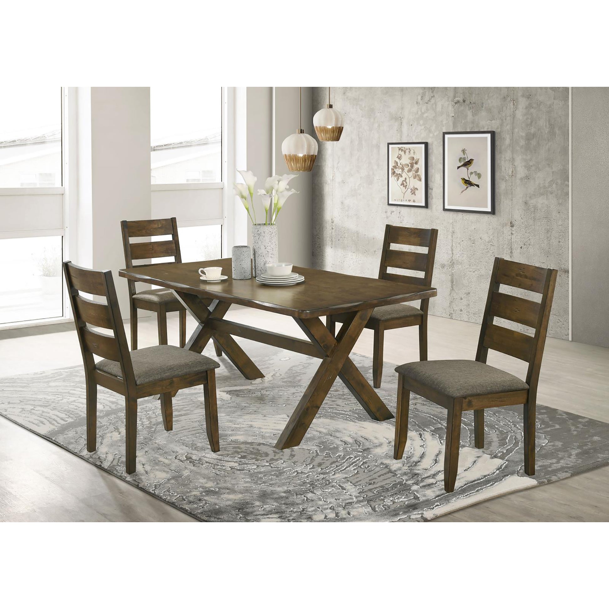 Rustic dark wood dining table with four upholstered chairs set on a modern rug