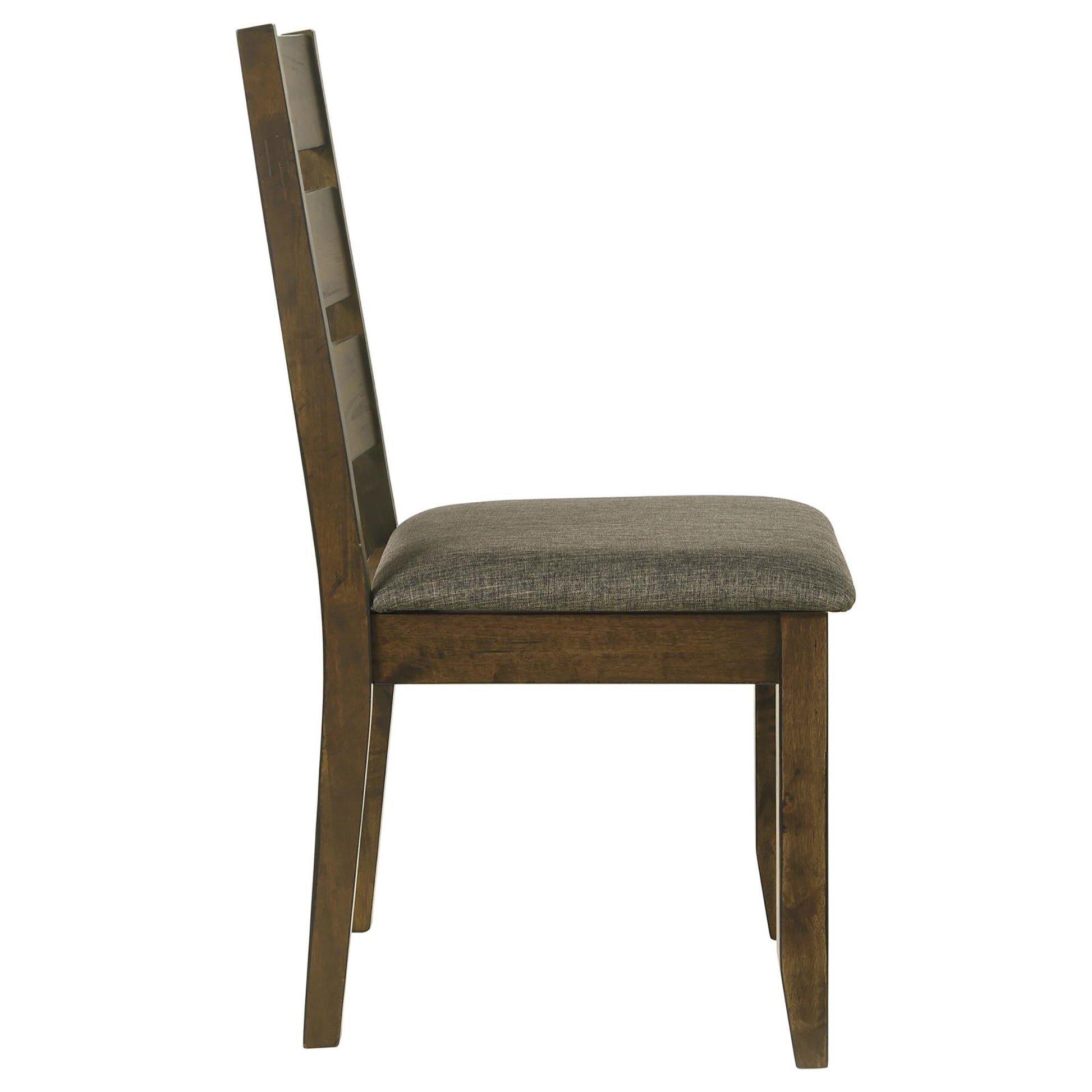 Side view of a wooden dining chair with a textured gray upholstered seat and ladder back design