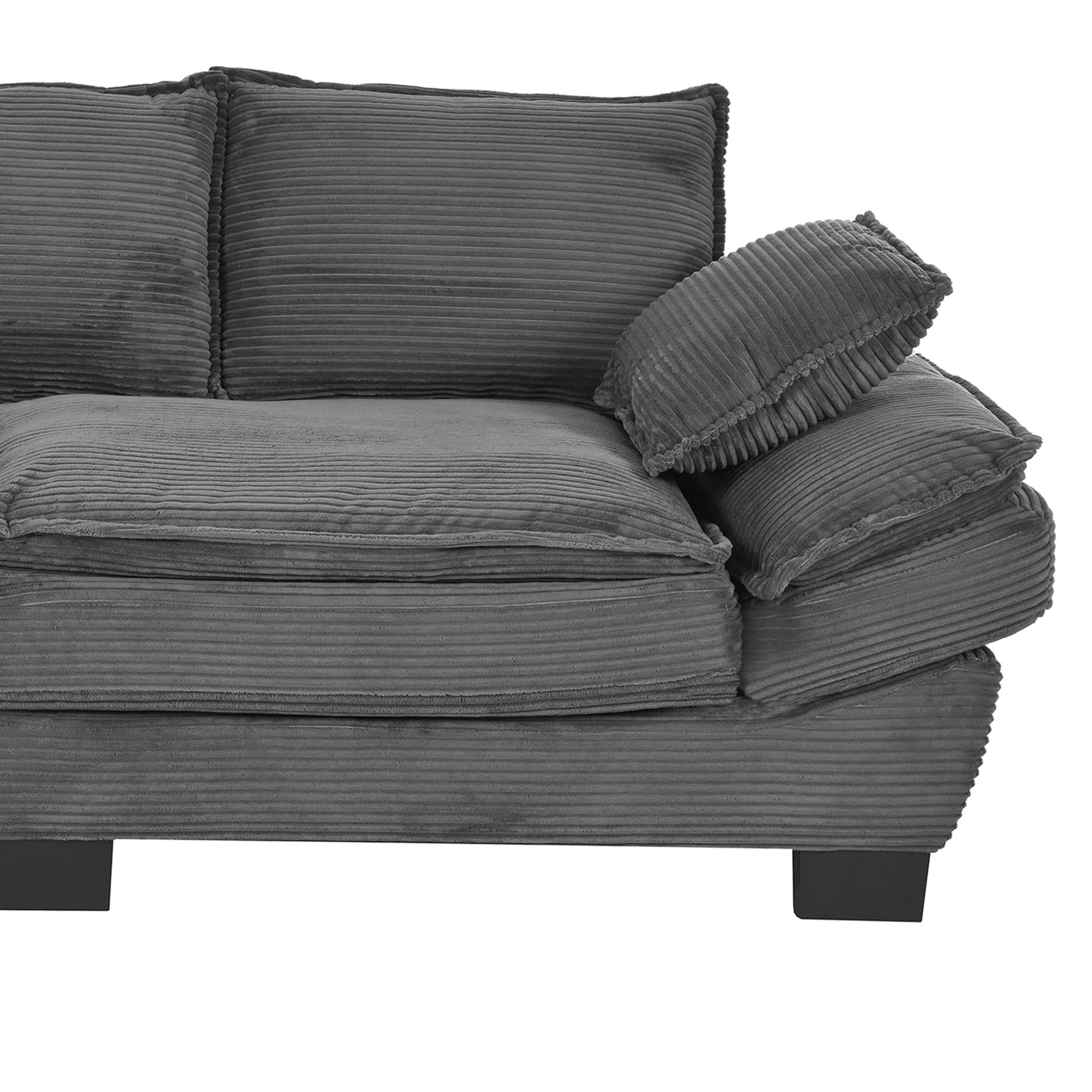 Closeup of a charcoal grey corduroy sofa with plush cushions and square legs