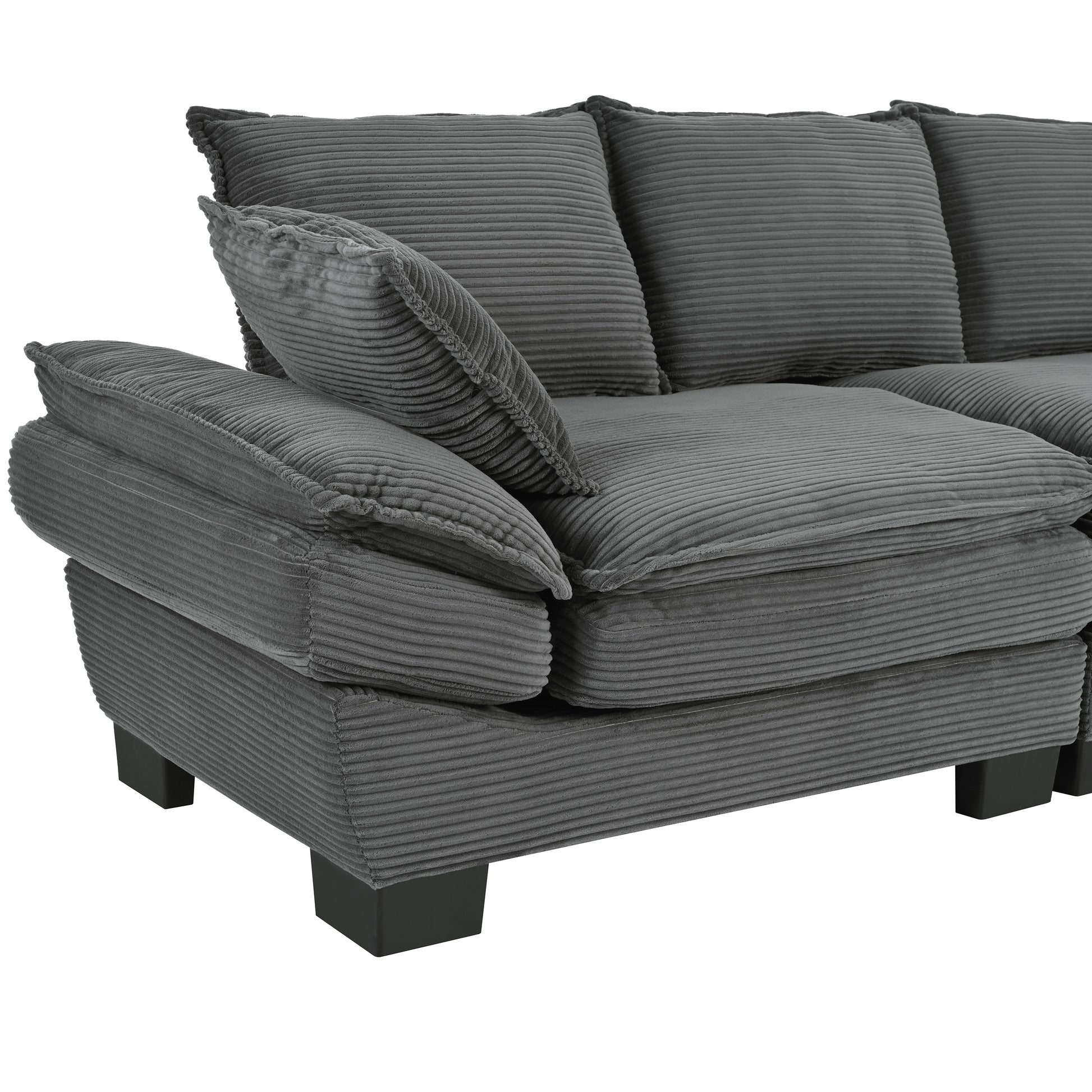 Plush grey corduroy sectional sofa with deep cushions and matching throw pillows
