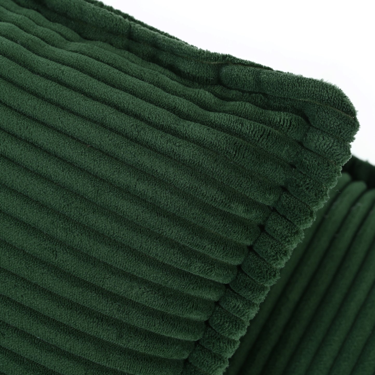 Deep green corduroy cushion with plush texture and raised ribs