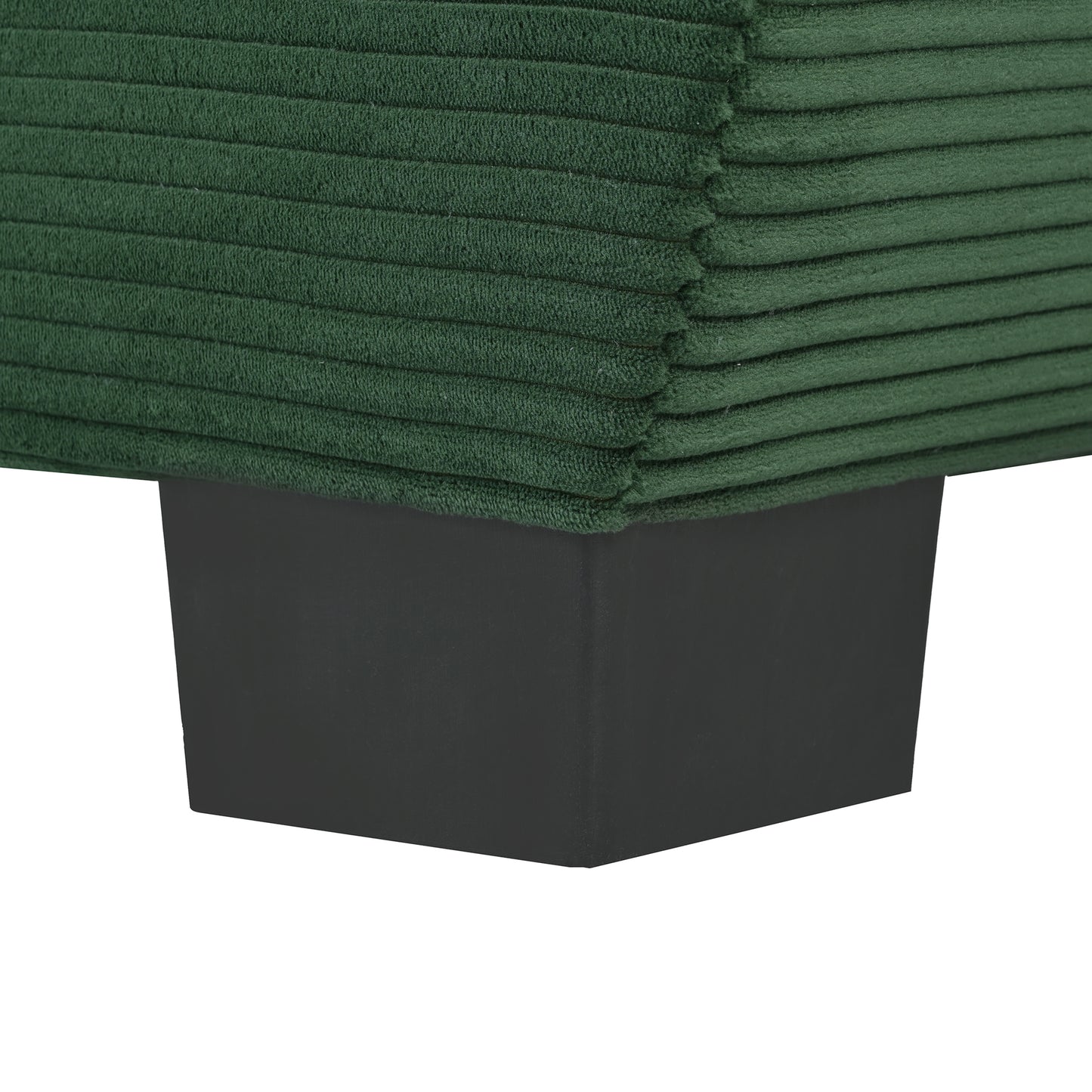 Dark green corduroy sofa cushion corner with black rectangular leg