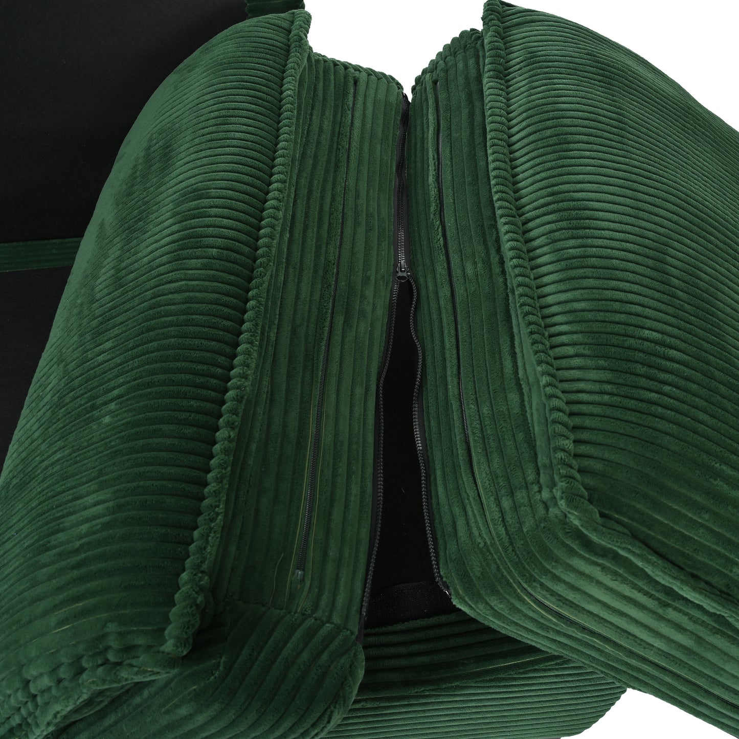 Deep green corduroy pillow with visible zipper closure and plush texture