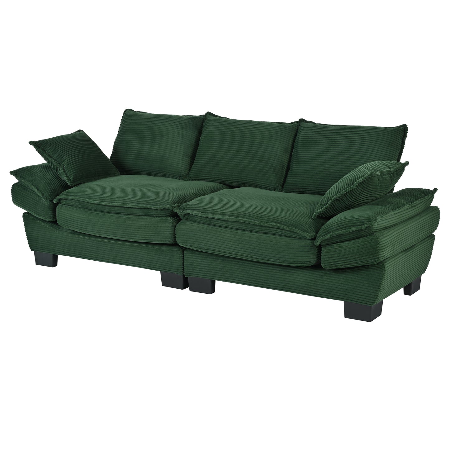 Plush emerald green corduroy sofa with deep seat cushions and matching throw pillows