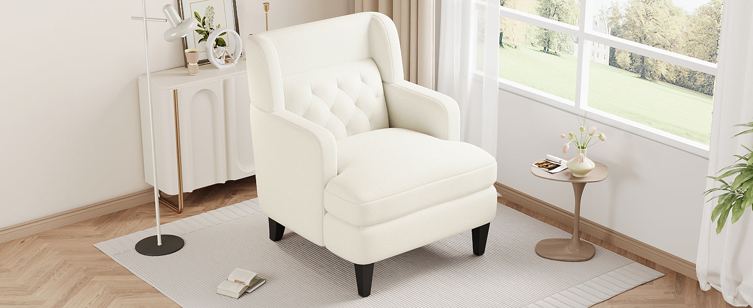 Cream boucle armchair with tufted back and dark wooden legs