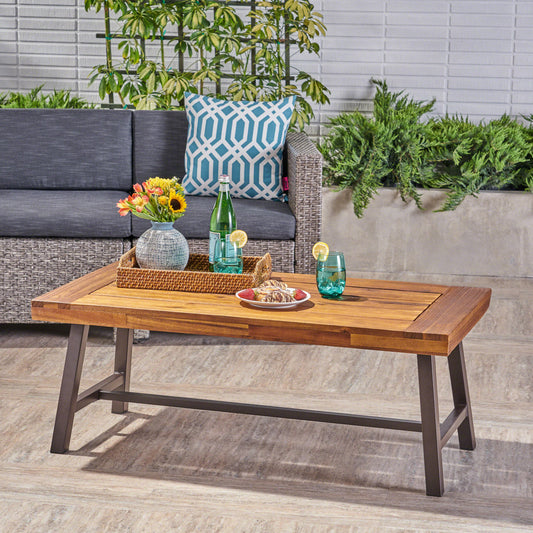 Acacia wood coffee table with dark metal legs featuring a rustic modern design