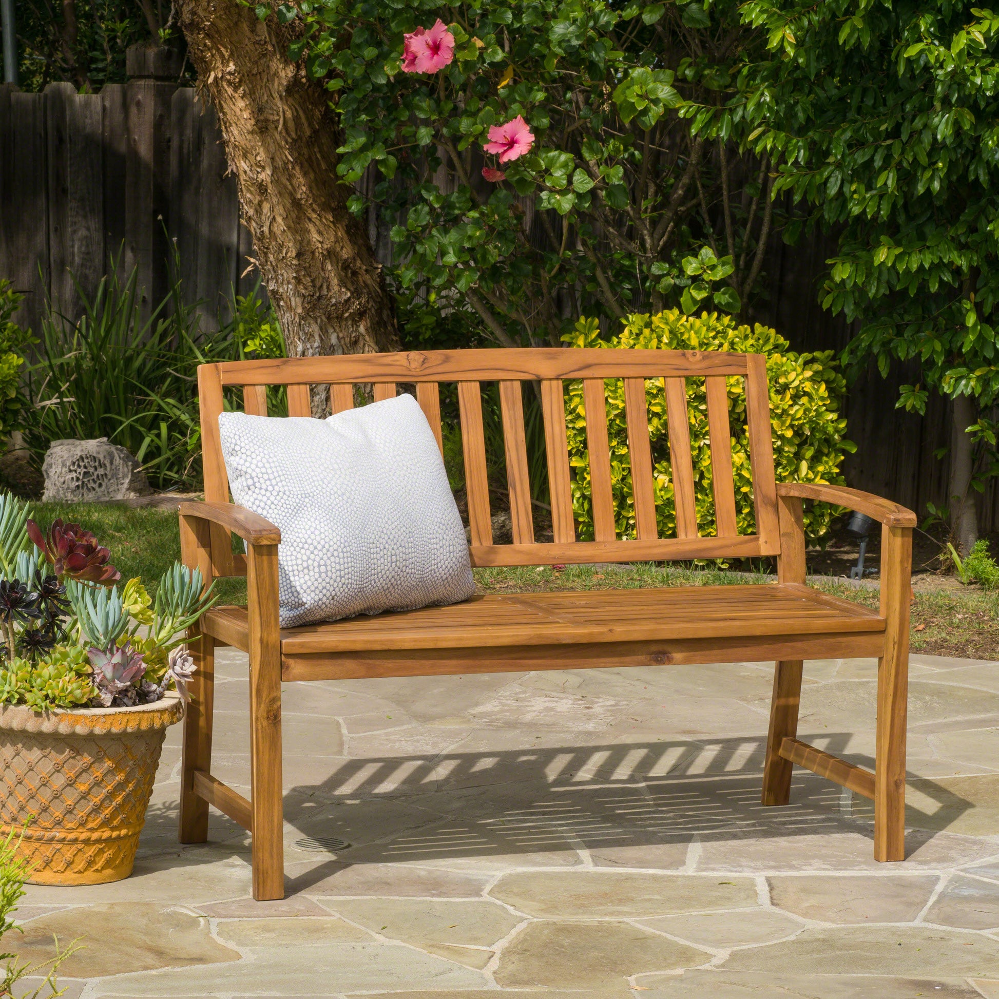Wooden garden bench with slatted back and seat includes light grey cushion