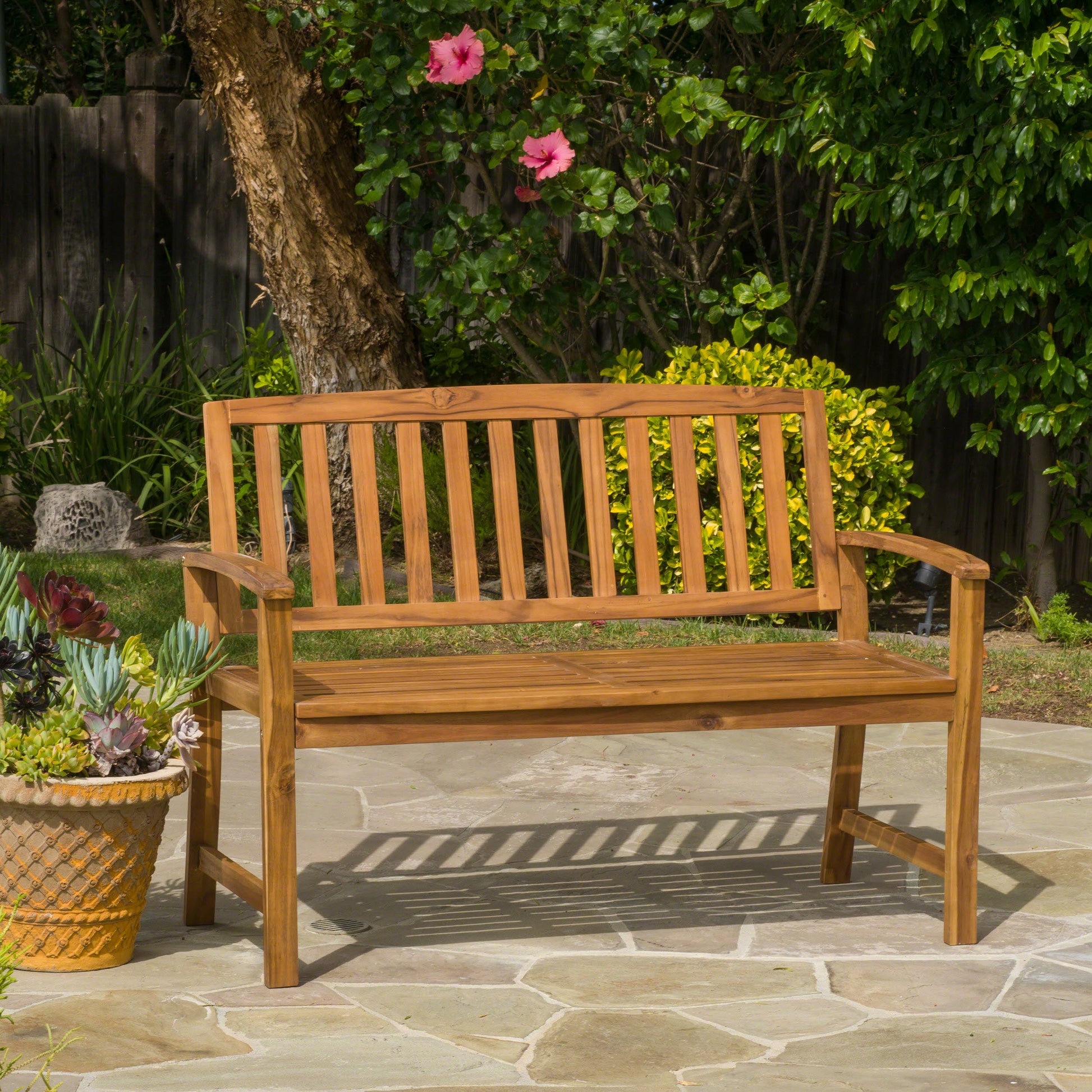 Solid wood garden bench with slatted seat and back perfect for outdoor relaxation