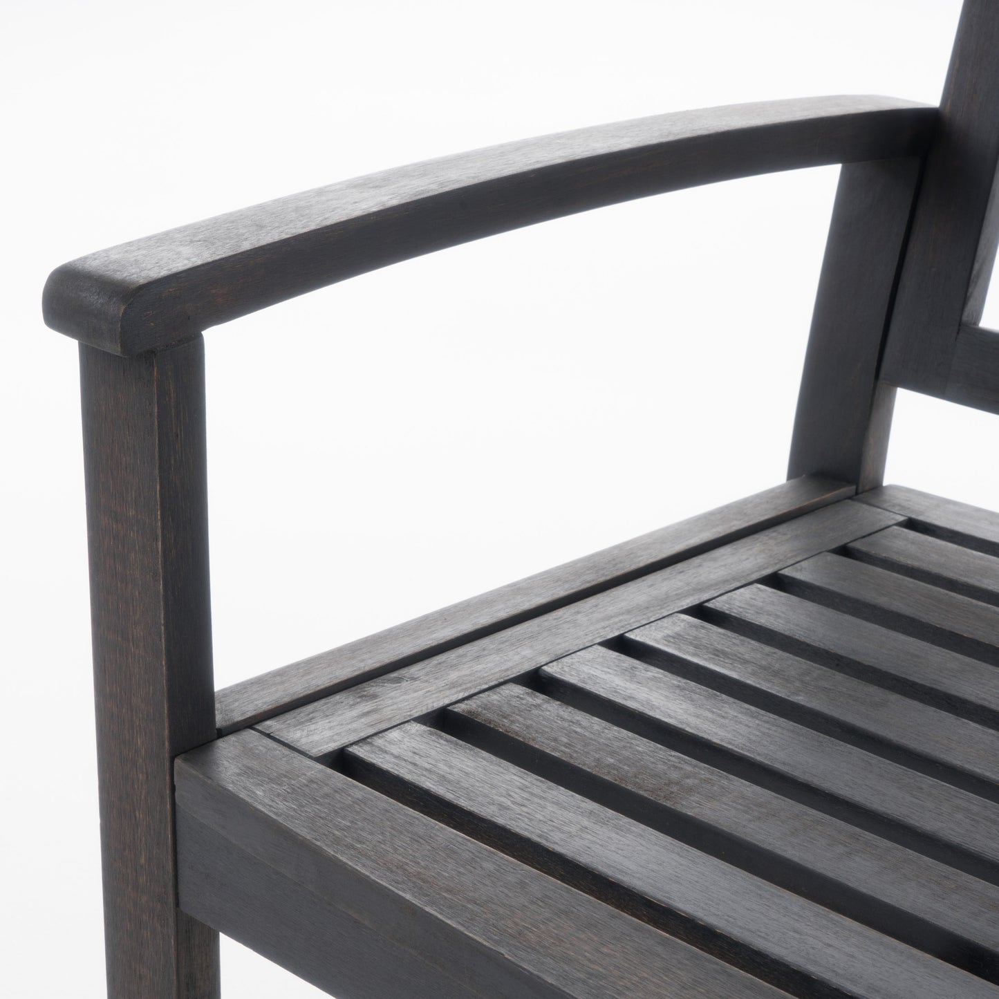 Dark wood garden chair armrest and slatted seat detail