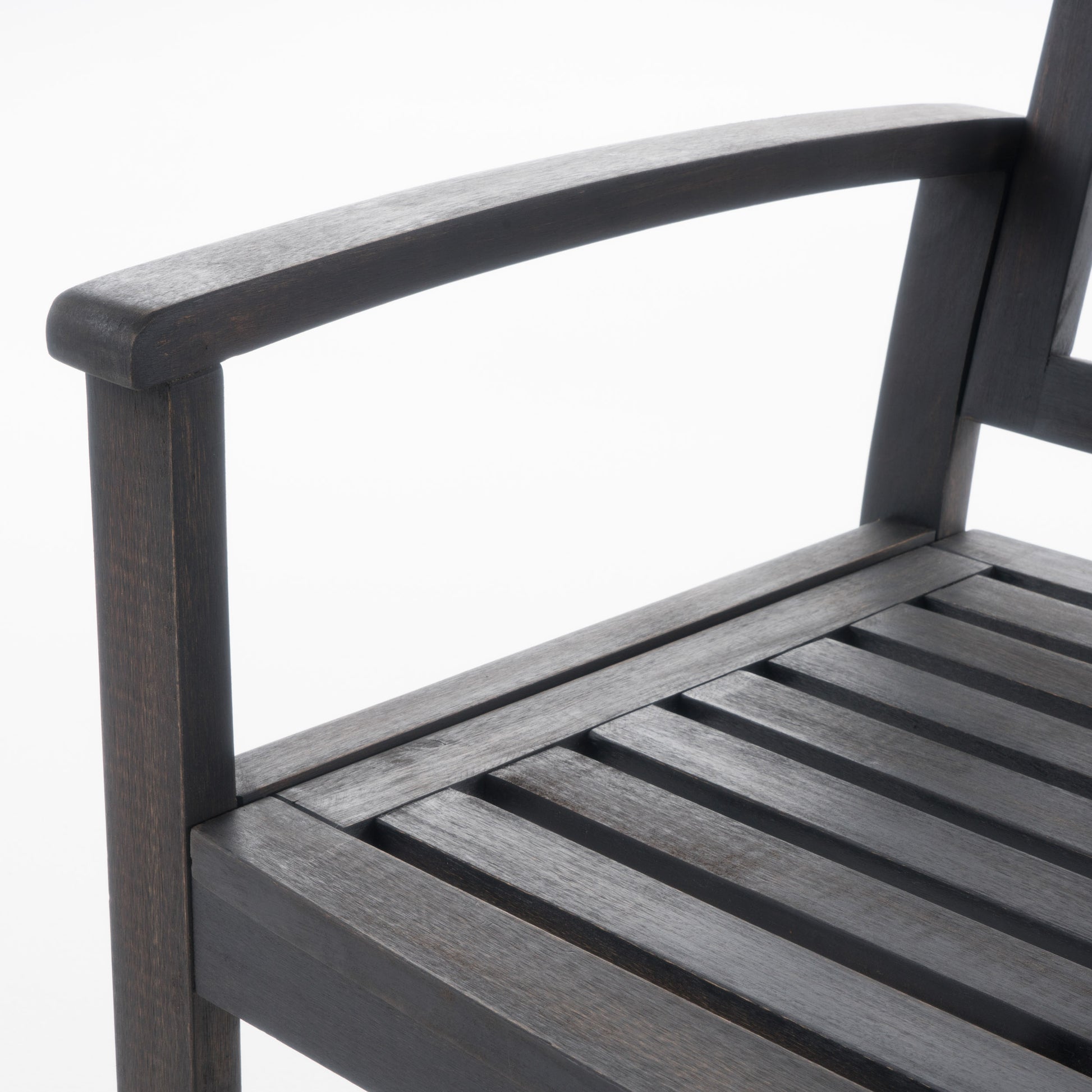 Dark wood garden chair armrest and slatted seat detail