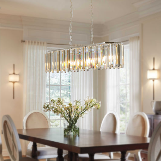 Rectangular crystal chandelier with chrome accents illuminating a dining room setting