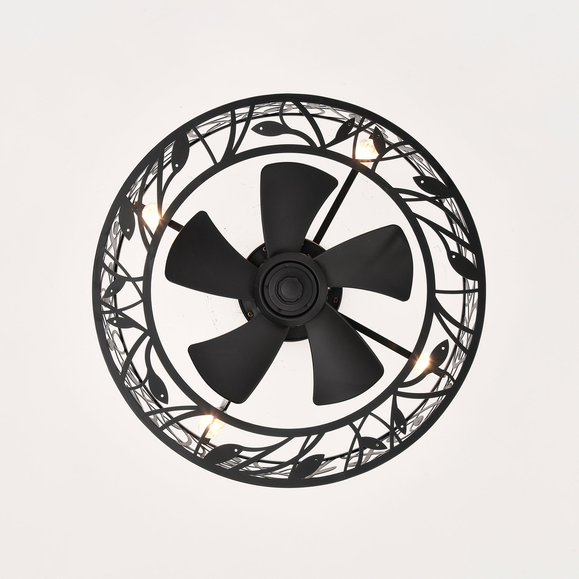 Black industrial ceiling fan with ornate metal leaf design and integrated lights