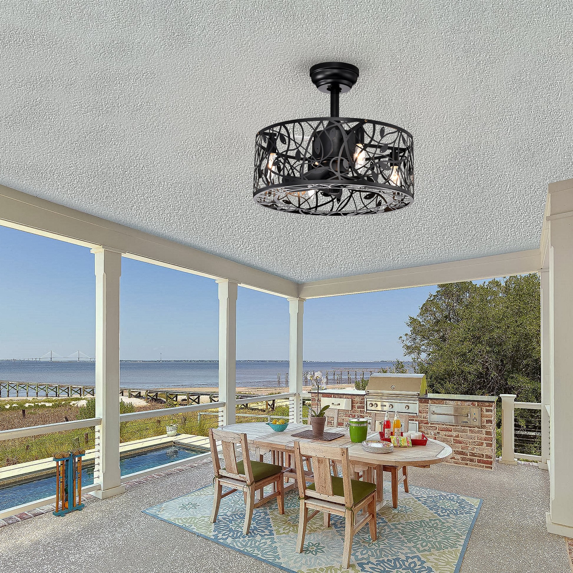 Black metal flush mount ceiling fan with ornate leaf pattern cage and integrated lights