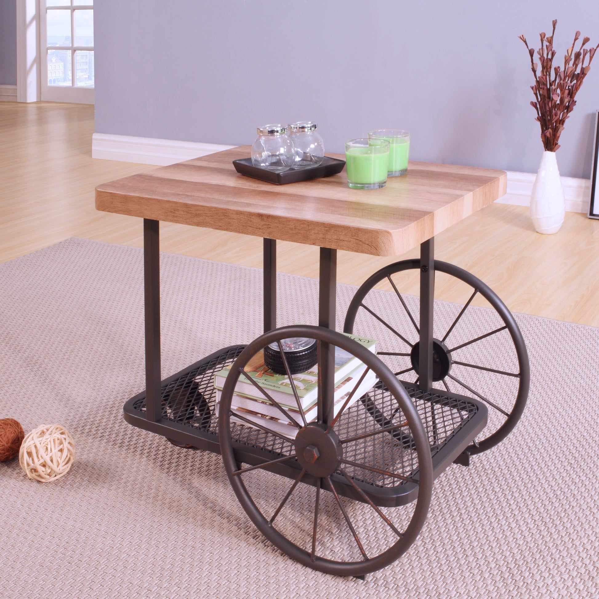 Rustic wood top coffee table with industrial wagon wheels and lower shelf for storage